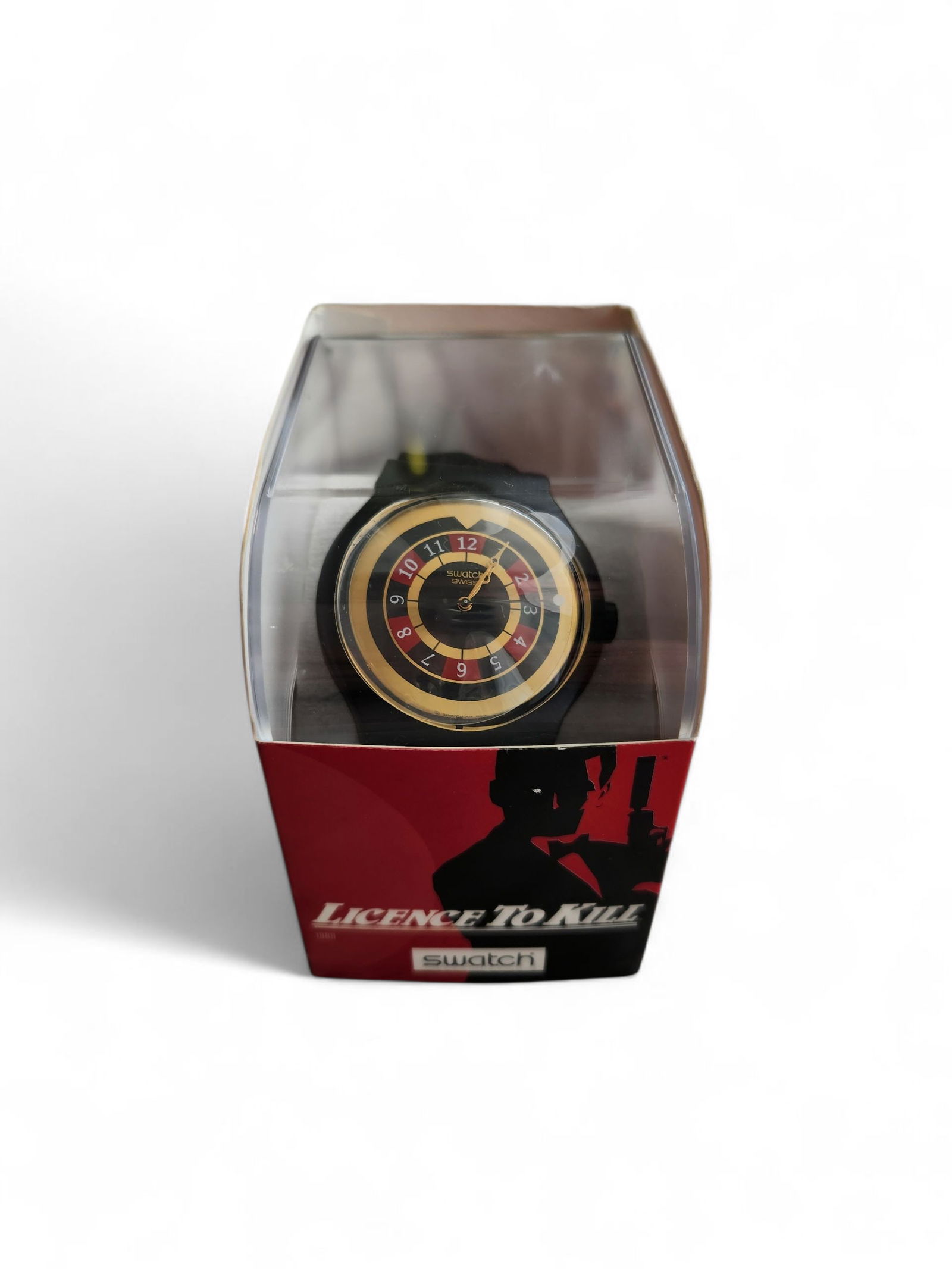 Licence To Kill Swatch Watch / w Box: SUDB103 "License To Kill" Specials Collection Swatch Watch. Themed after the 1989 James Bond 007 film License To Kill. Seems to be un owrn still has plastic cover on bezel. Battery is working.