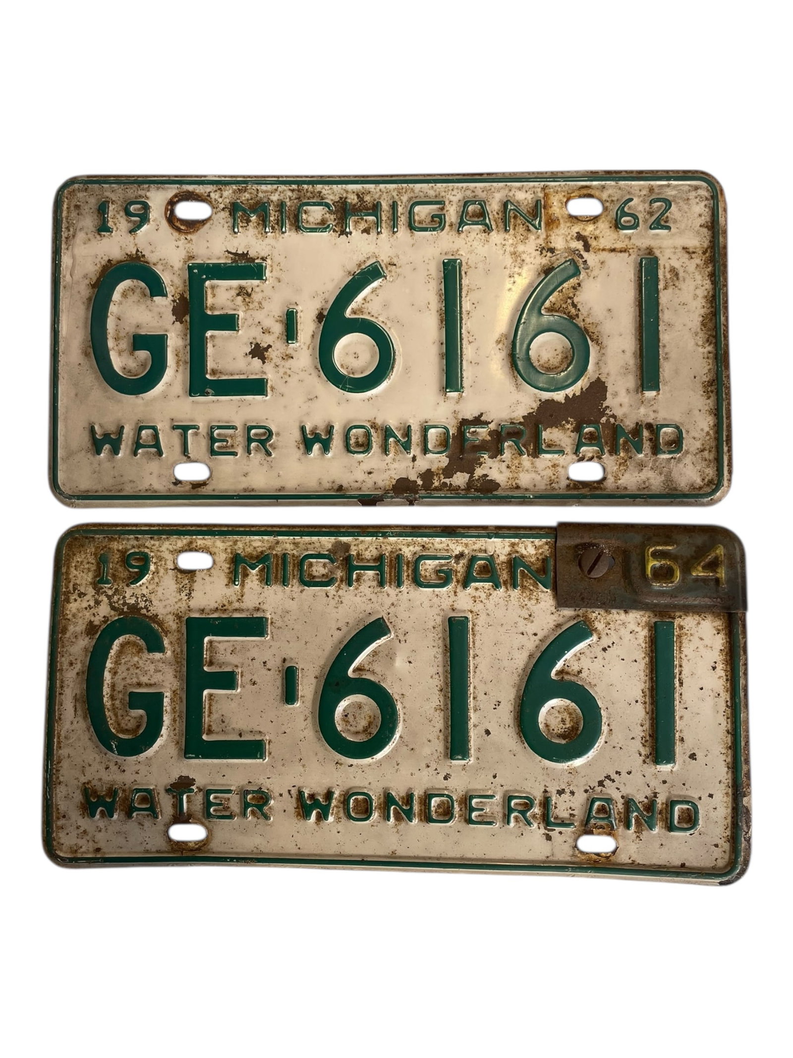 2 1962 Michigan License Plates: 2 1962 Michigan License Plates One has a corner attachment that changes it to 1964.