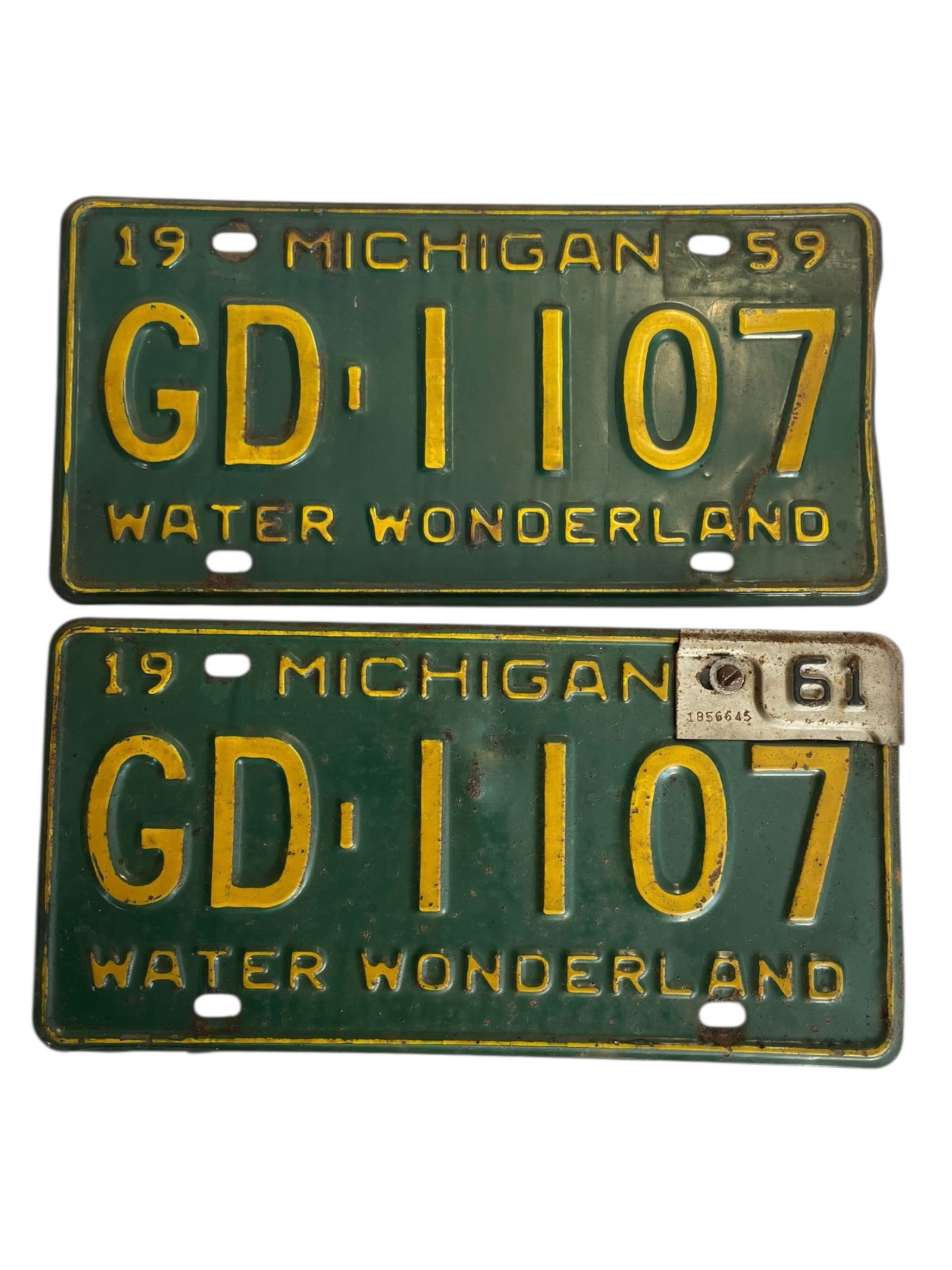 2 1959 Michigan License Plates: 2 1959 Michigan License Plates One has an attachment that changes it to 1961.