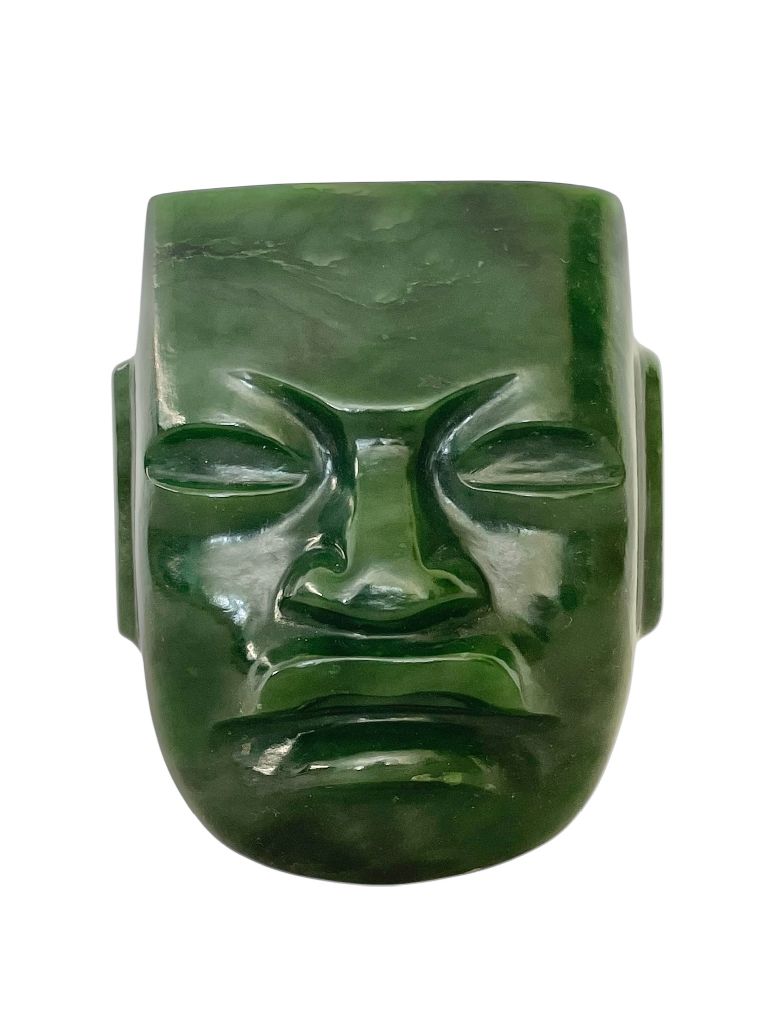 Carved Jade Olmec Face Mask, 4 1/2" Tall: Carved Jade Olmec Face Mask, 4 1/2" Tall. This is a striking sculpture, heavy stone, green jade, with slight hollow on the back. Originally purchased from a lapidary shop in New Orleans for $1100;