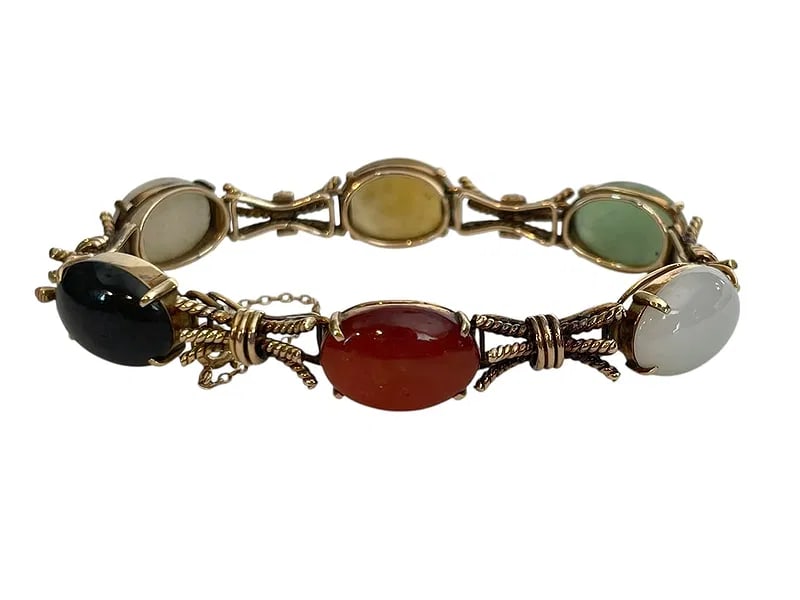 Multi-Color Jade Bracelet, 14K Gold ~ 27.5 grams: Multi-Color Jade Bracelet, 14K Gold ~ 27.5 grams Featuring six different colors/varieties of oval stones, set in yellow gold. It's a fine quality bracelet with safety catch and chain; marked 14K.