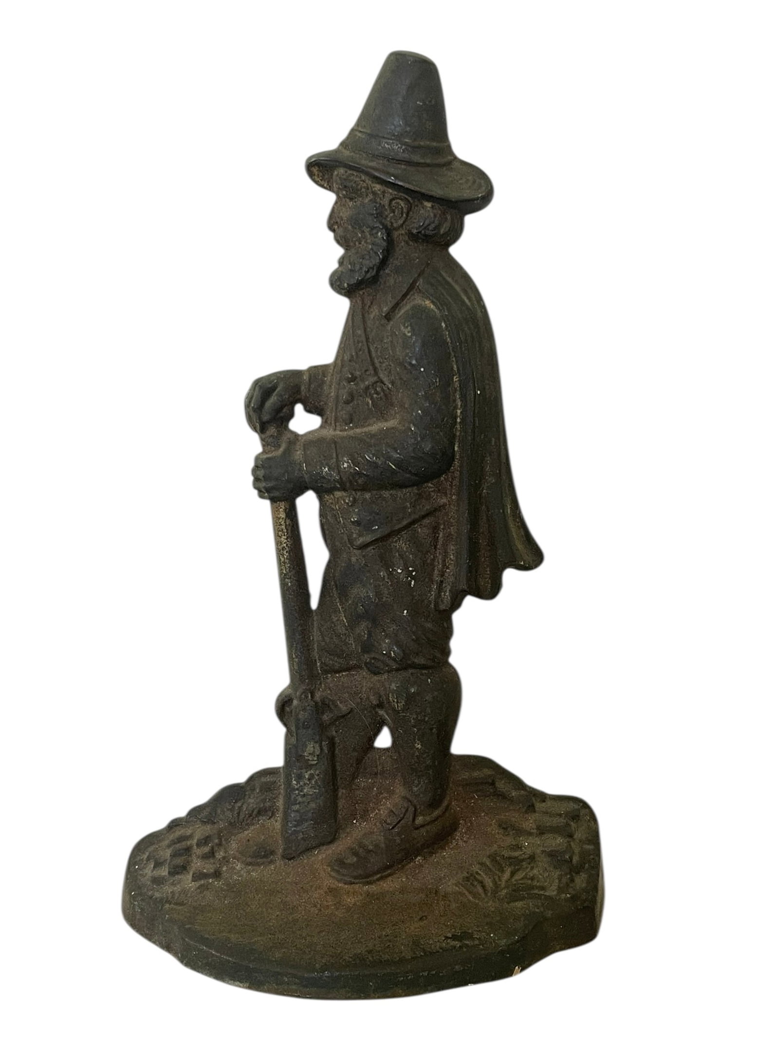 Bradley & Hubbard Cast Iron Pilgrim with Gun Doorstop, 10.5": Bradley & Hubbard Cast Iron Pilgrim Doorstop. A man with a gun, heavy doorstop, marked B&H. It appears to have had a brass finish which is worn away. It is also dusty. There are rubber bumpers