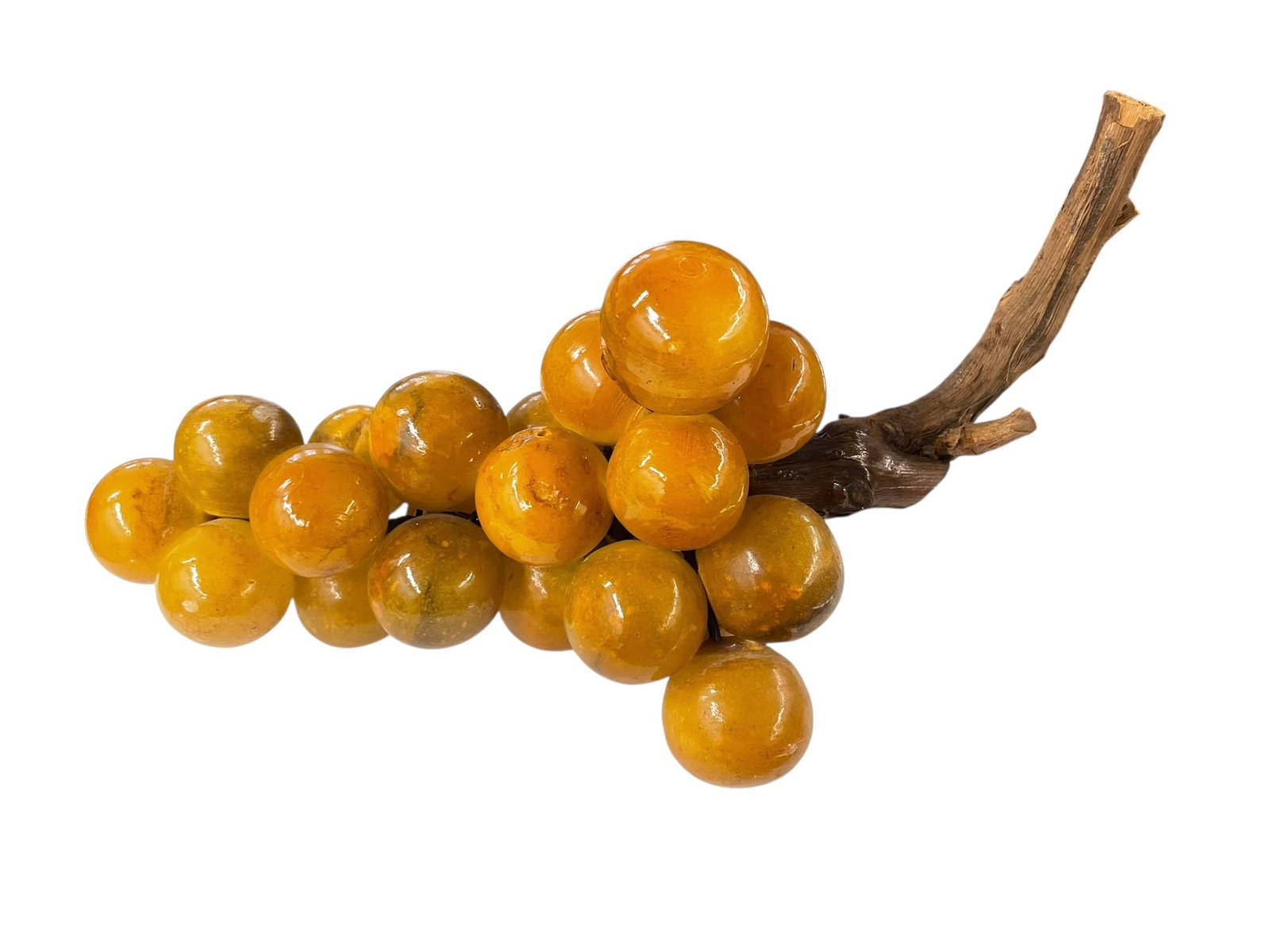 Mid-Century Alabaster Stone Grapes: Carved stone grapes, honey amber color, attached to real wood. 11" total length, grapes are about 1.25" diameter.