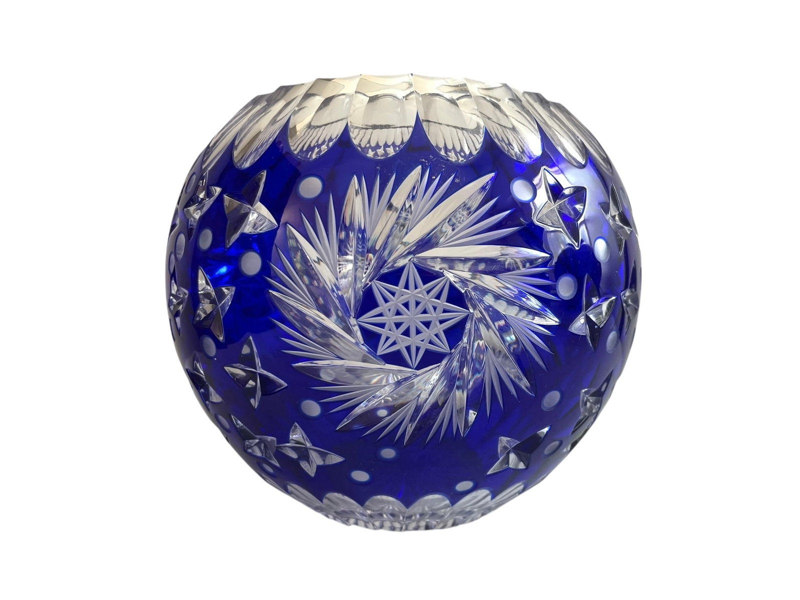 Bohemian Cobalt Cut to Clear Crystal Rose Bowl: With a gorgeous star design. Note, there is a chip that's mostly on the underside of the rim (photographed). 5 1/2" tall, about 6 1/2" diameter.