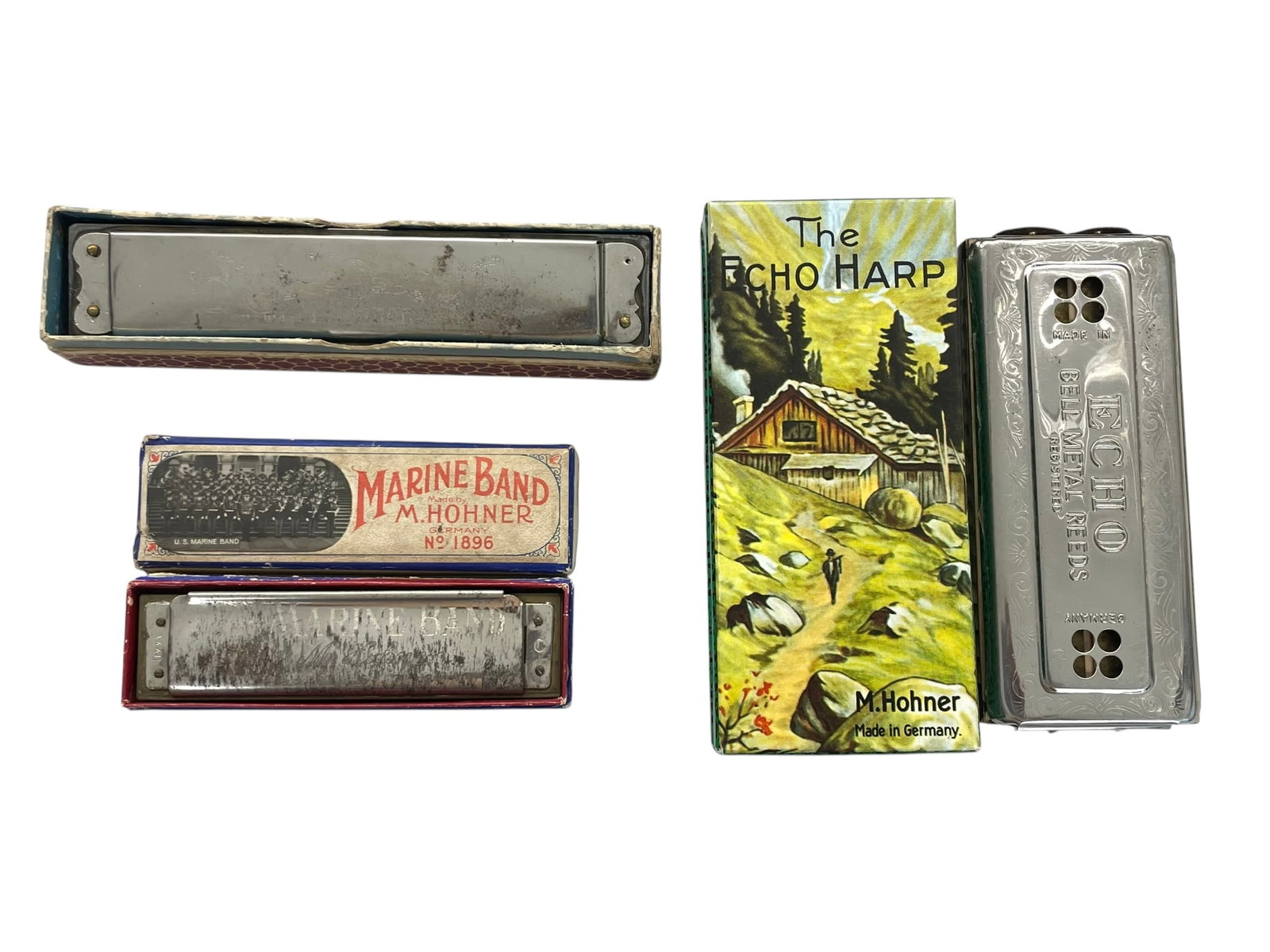 3 Hohner Harmonicas: Echo, Echo Harp, Marine Band: - Echo Harp with original box, made in Germany, bell metal reeds, keys C & G, 5" long. - Marine Band harmonica #1896, with original box, key of C, 4" long. - Echo harmonica, made in Germ
