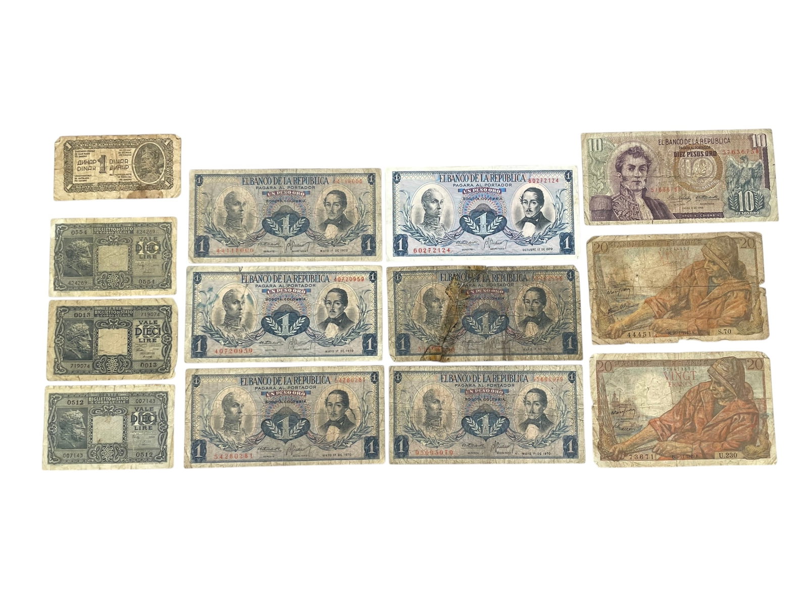 World Currency Group: Assorted world currency bills including Columbian pesos, French francs, others. See photos for condition and details.