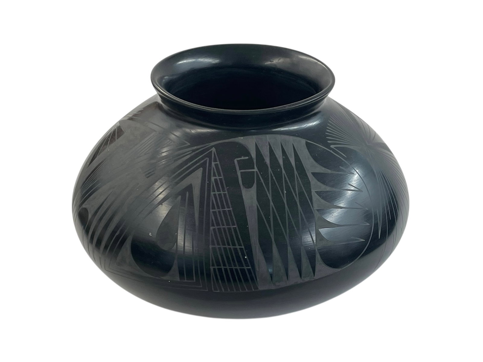 Oscar Quezada Casas Grandes Pottery: Black-on-black geometric design, 6" tall, 9" wide. Signed: Oscar G. Quezada Artist info: Oscar Gonzales Quezada is the second son of Consolacion Quezada and Consolacion's first husband. He