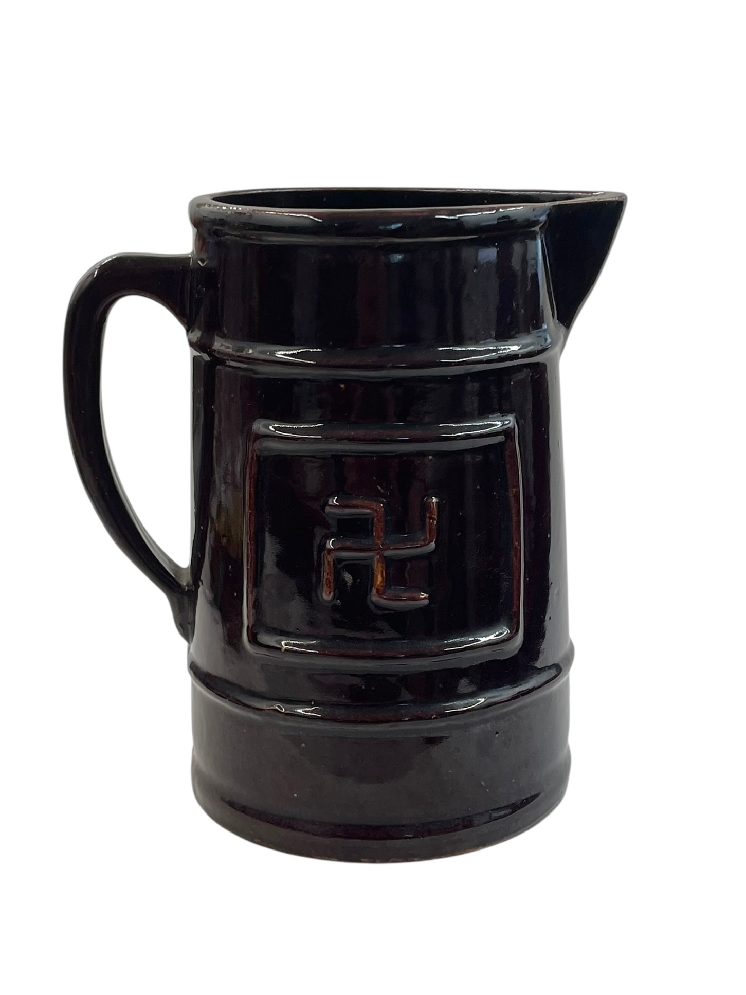 Antique Stoneware Pitcher with Whirling Logs Symbol: Featuring an ancient cultural symbol (swastika) meaning good luck, with Native American Navajo connotations of the Four Directions also. 9" tall. Possibly made by McCoy, unmarked