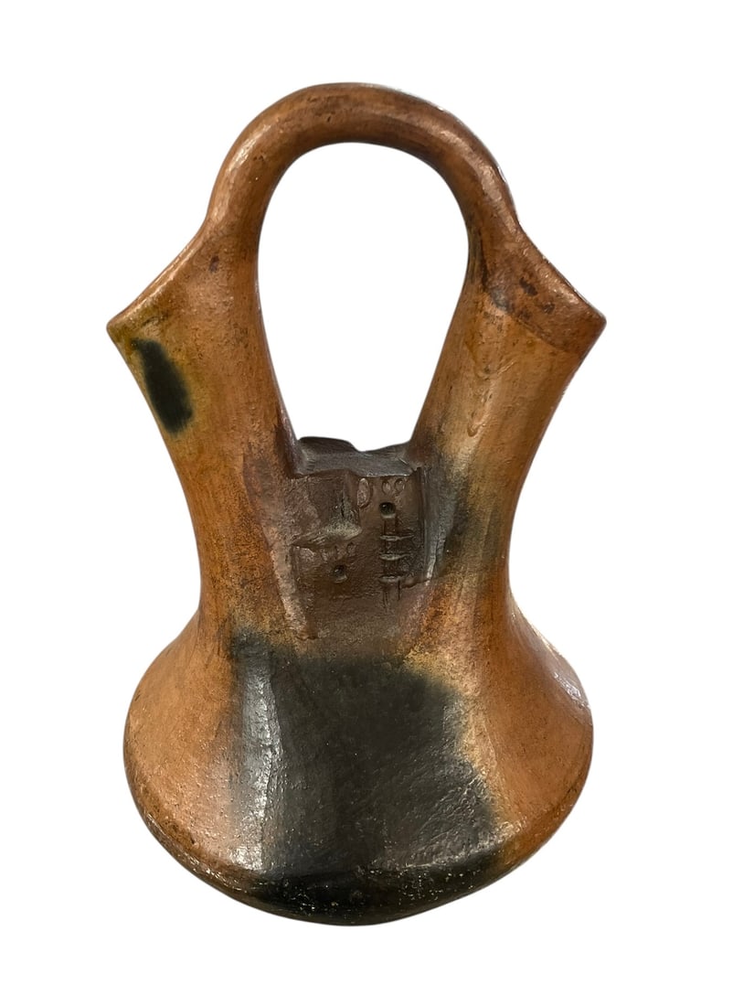 Elsie Bigman Navajo Wedding Vase: Traditional pottery with a pueblo design in the center, signed EB. Elsie Bigman (aka Elsie Bigman Black). 9" tall. Artist info: Navajo Indian potter Elsie Bigman and her family have been