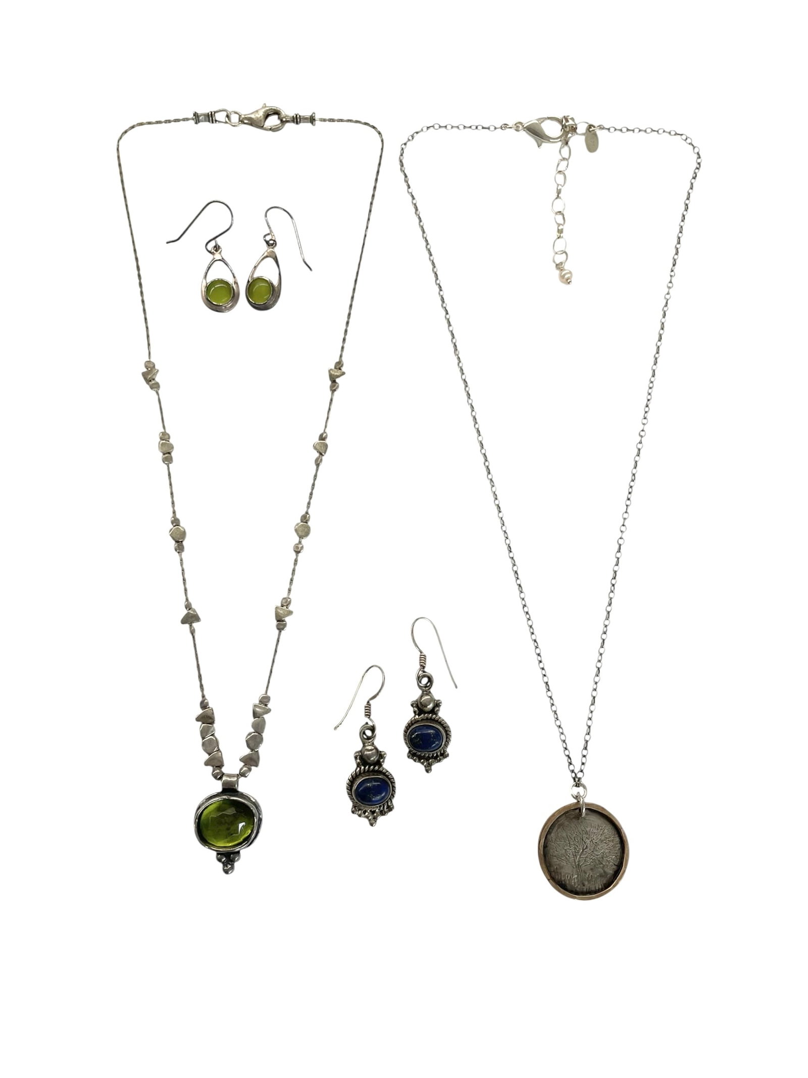Sterling Silver Necklaces and Earrings ~ 26.3 grams: All pieces are marked 925 for sterling. * Green stone necklace with earrings. * Blue lapis drop earrings. * Tree of Life pendant on chain. Total weight: 26.3 grams