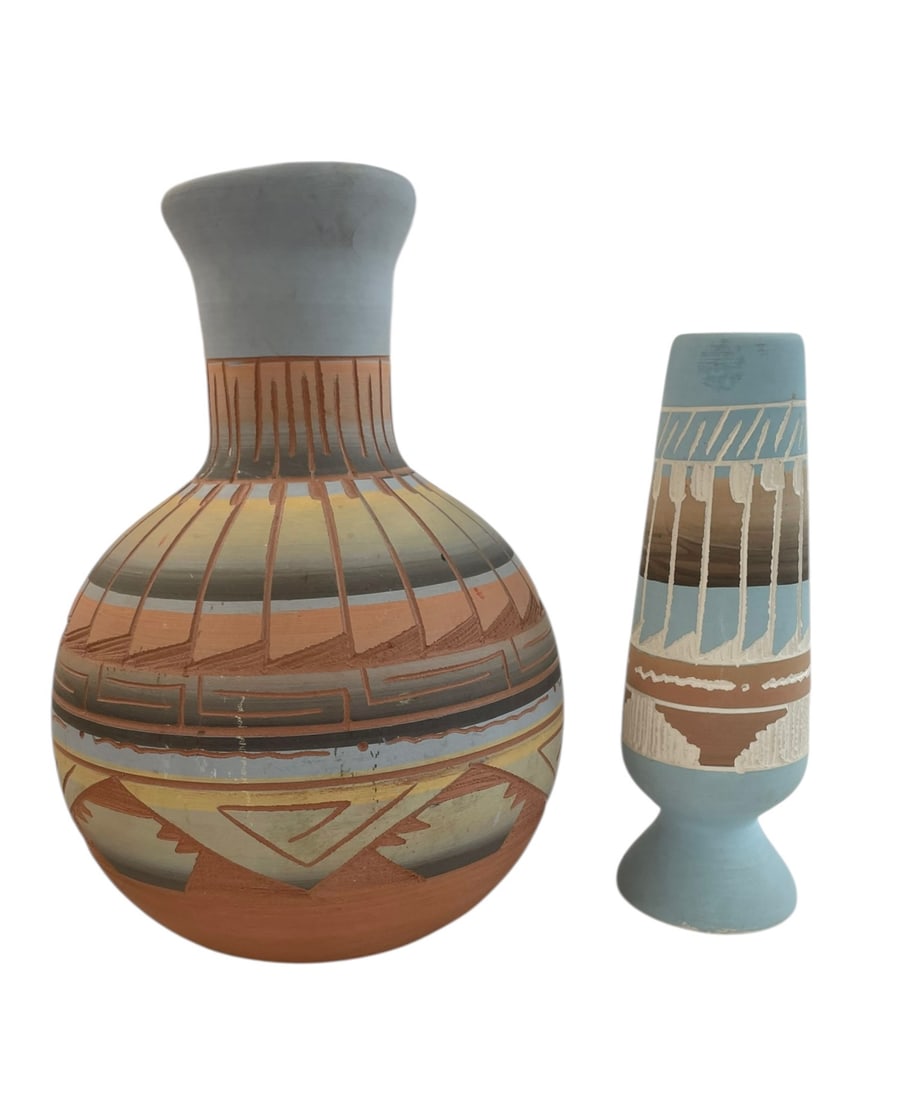 2 Navajo Incised Pottery, Signed V.W. and T.W.: 2 Native American pieces: Larger pottery vase, 8" tall, signed: Navajo / V.W. Smaller pottery vase, 6 1/2" tall, signed: T.W. / Navajo.