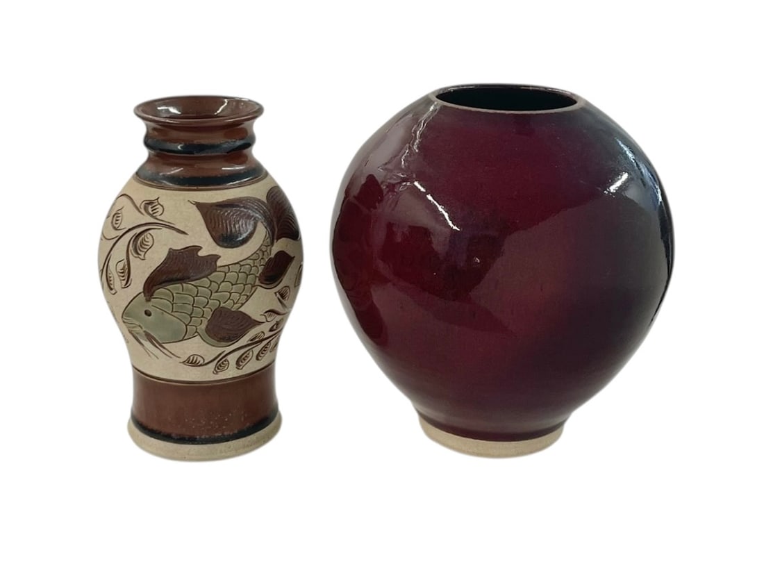 Mark Blumenfeld Studio Pottery Fish Vase and Round Pot: California art pottery: The 8" vase has a catfish design with leafy swirls. The round vase/pot is burgundy color, 8" tall. Both in good condition, and both signed Blumenfeld. 
