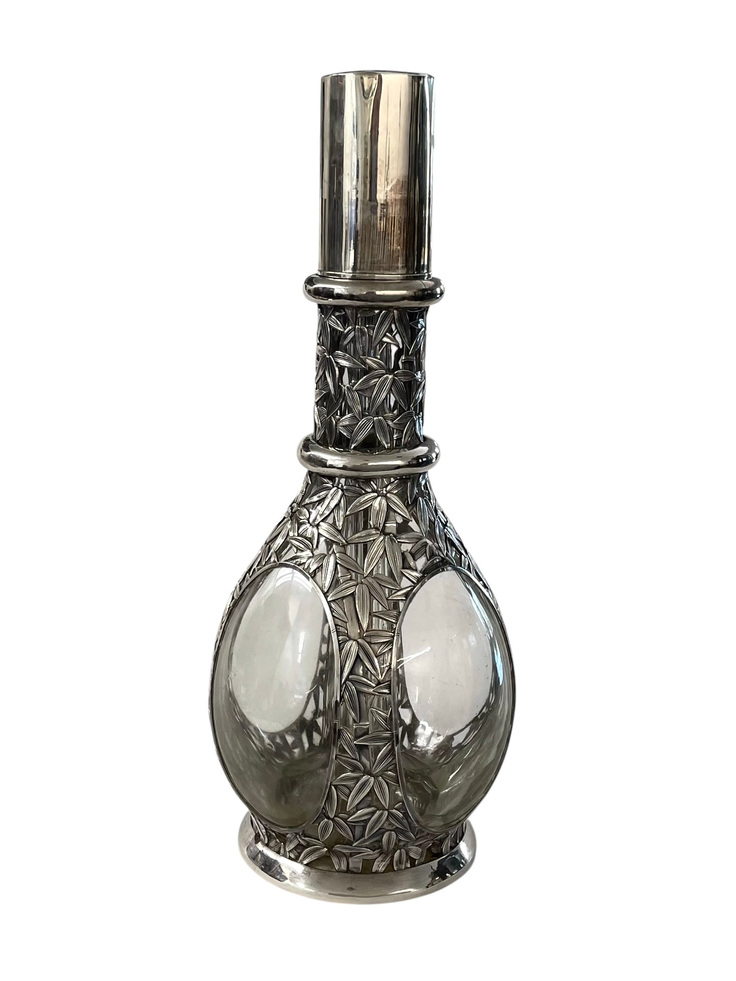 French Four Chamber Decanter with 950 Silver Japanese Bamboo Overlay: A French four-part decanter bottle, encased in 950 silver. The silver work is a detailed rendering of bamboo stalks and leaves; this was probably an early 20th century Japanese export using a