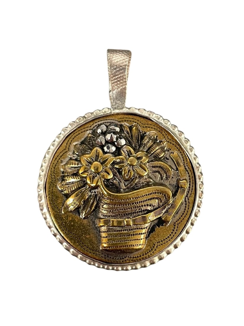 Antique Flower Basket Button Pendant, Sterling Silver: An antique button accented with marcasites, in a handcrafted silver bezel pendant setting. Marked: Sterling. 1 1/4" diameter and 1 1/2" total length with bail.