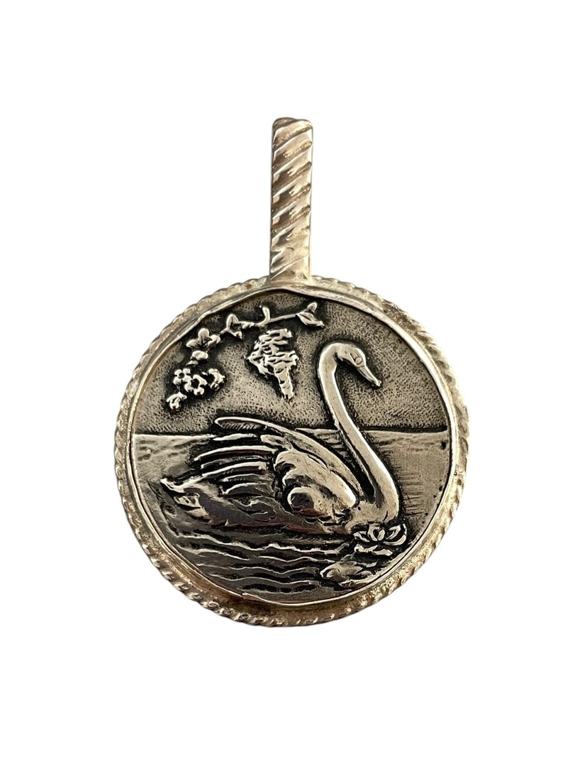 Antique Swan Button Pendant, Sterling Silver: An antique picture button of a swimming swan, set in a handcrafted silver bezel pendant setting. Marked: Sterling. 1 1/8" diameter and 1 5/8" total length with bail.