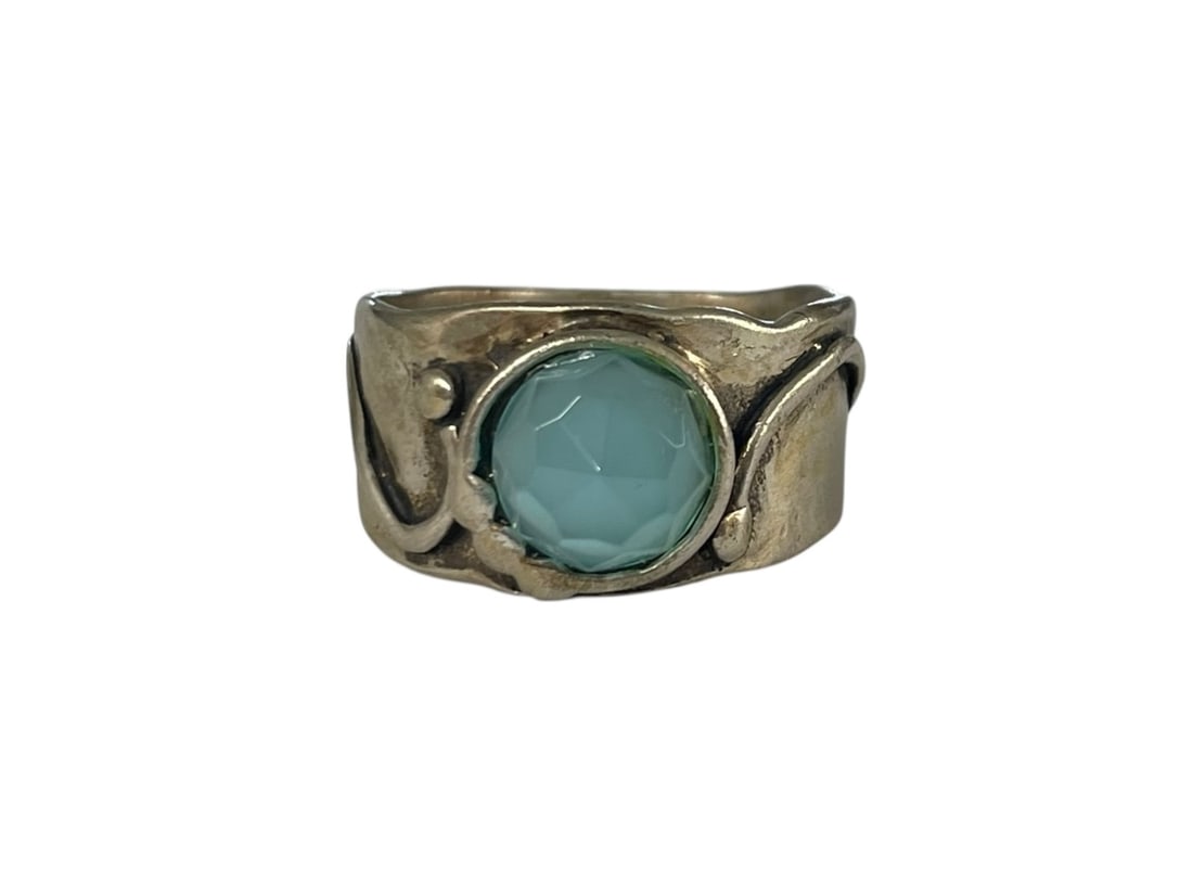 Blue Chalcedony Sterling Silver Ring: Size 8. Marked: 925 and signed "Bill". Faceted blue stone believed to be chalcedony/quartz. Weight: 4.6 grams