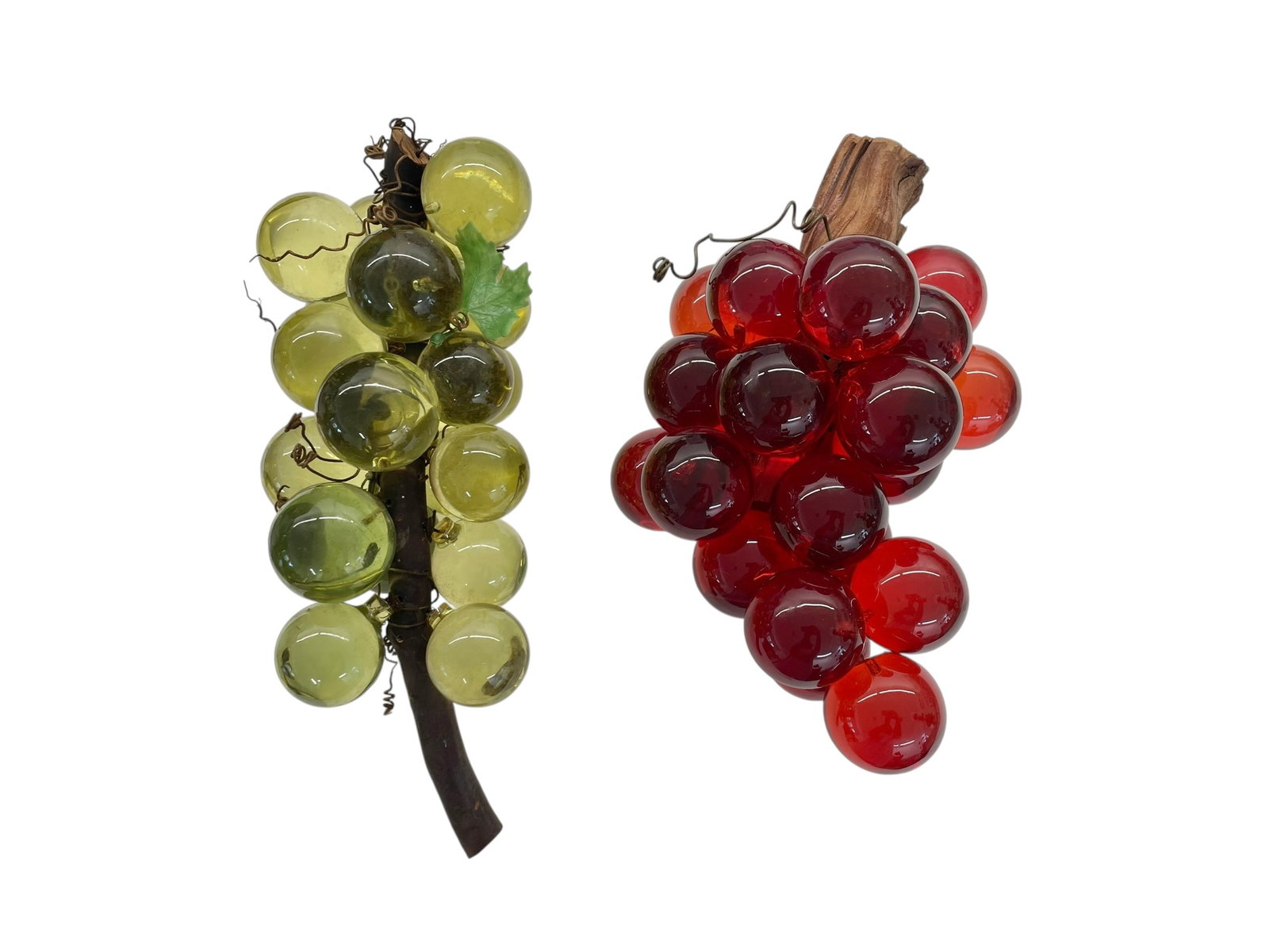 2 Mid-Century Lucite Grapes Bunches: Lucite or acrylic "grapes" fastened to real wood. The grapes are fairly large, almost 2" diameter. Overall size is about 12"-14" long. Both bunches for the bid!