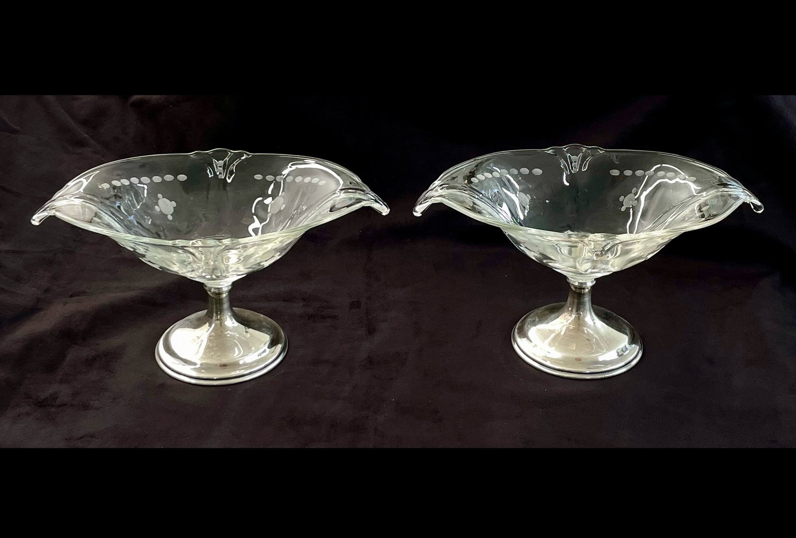 Pair of Sterling Silver and Glass Candy Dishes: Etched glass on sterling silver pedestals. Marked: Sterling / 30 PWTS [pennyweights]. The dishes are about 5" x 8" (elongated shape). The height of these pieces are 4.5" each.