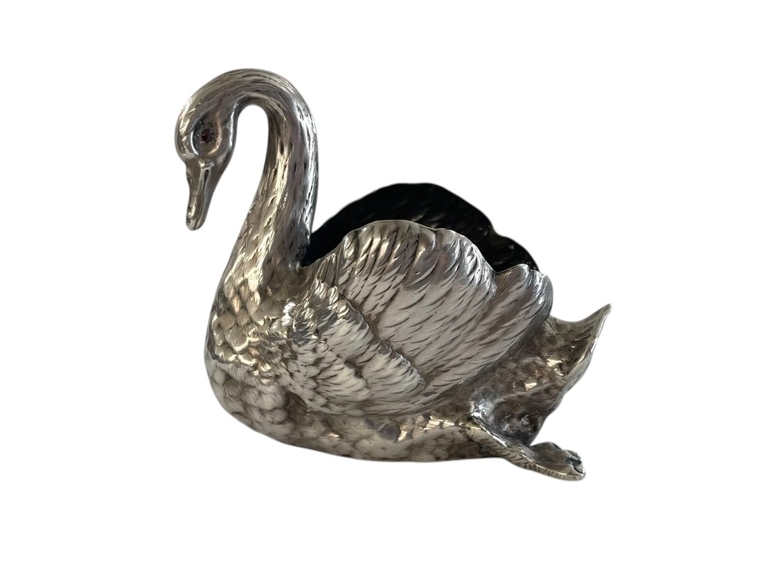 Sterling Swimming Swan Salt Cellar with Ruby Eyes ~ 46 grams: Small figural dish, or salt cellar, a swimming swan with feet and ruby eyes, nicely detailed. Hallmarked and numbered, along with the word Sterling. Approx. 2 3/4" tall, 3" wide.