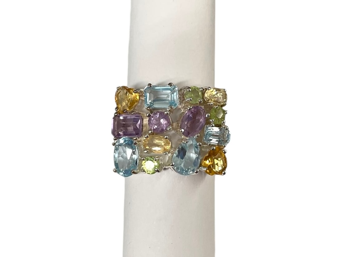 Multi Gemstone Sterling Silver Ring: Size 7. Marked: 925. Assorted colored gemstones in various colors, like new condition. Weight: 9.2 grams