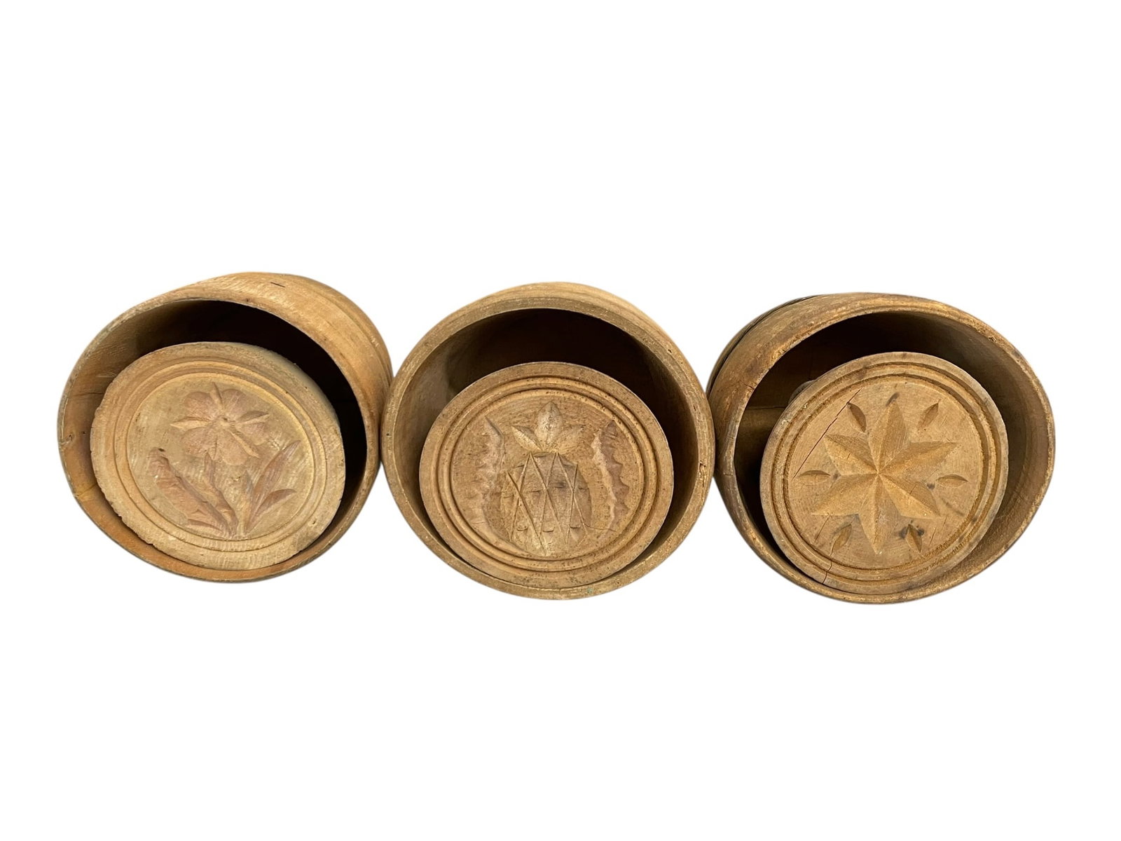3 Wood Butter Molds: Flower, Pineapple, Star: 4" wide molds (average), with 5" tall body (average) plus the extendable handle. They are each carved with a design that presses the top of the butter with a flower or pineapple or star.