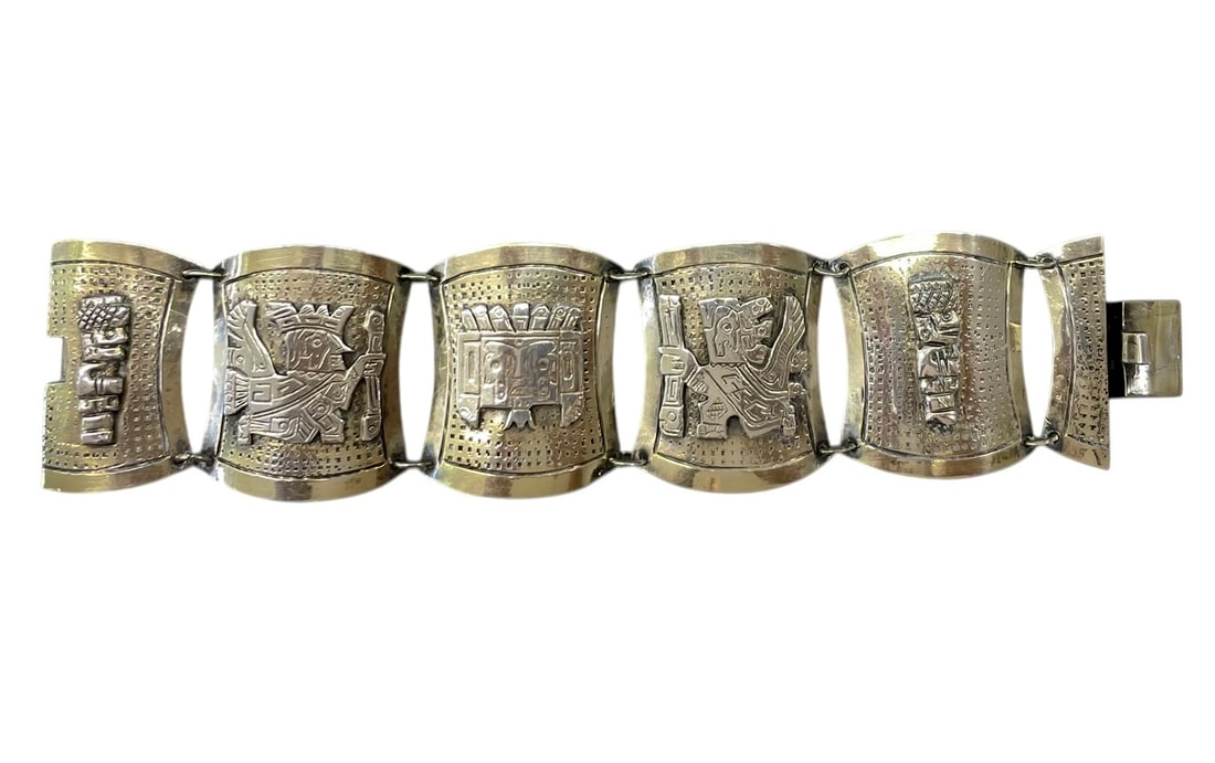 Peruvian Sterling Silver Bracelet ~ 59.6 grams: Inca style symbols on wide panels, stamped Peru. Also marked: 925 / PPP / Sterling / and other words as pictured. Length: 7 1/4" Width: 1 3/4" Weight: 59.6 grams