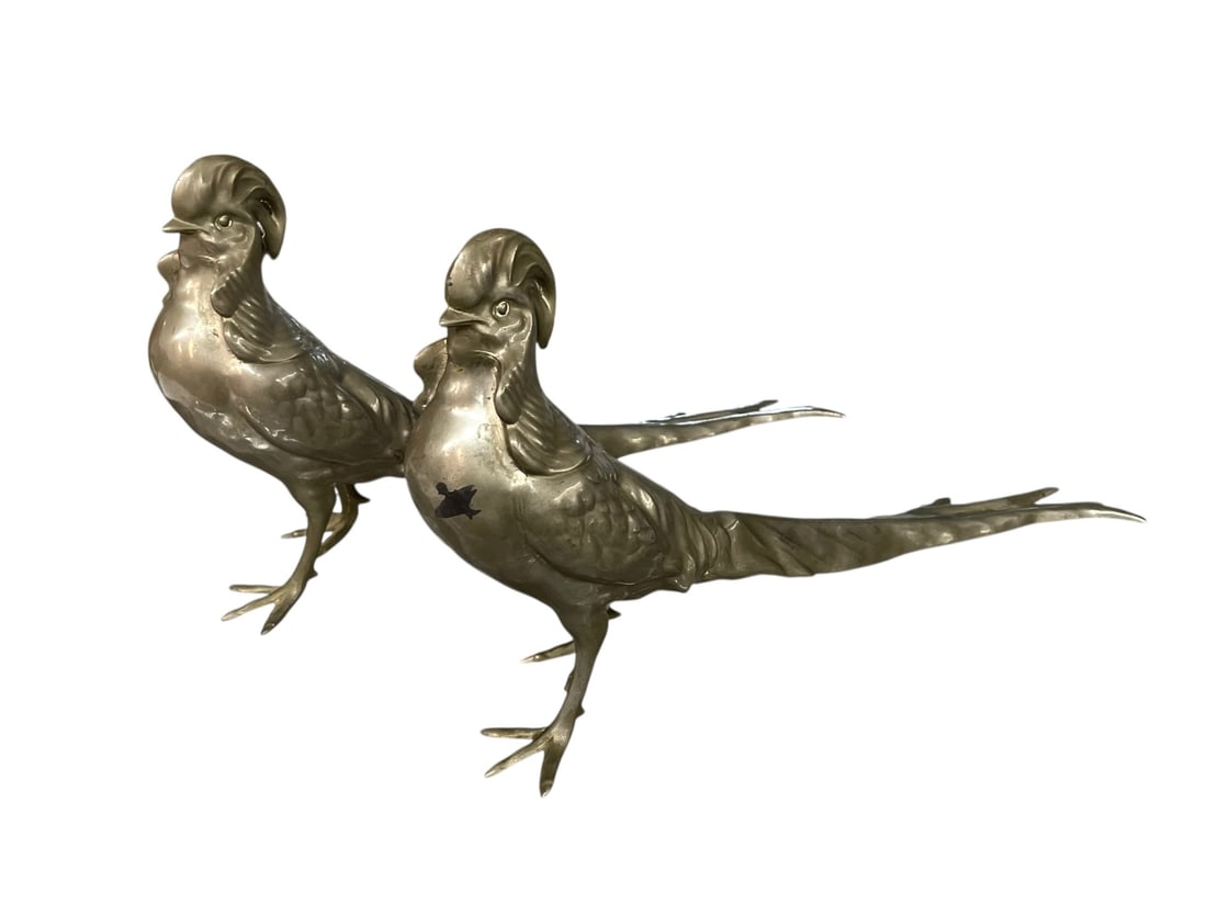 Vintage Pair of Pheasants: Tabletop pheasants, classic mid-century decor. Silvertone unidentified metal. Flaws include a missing toe, probable tail repair and dark splotch; see photos. 14" long, each.