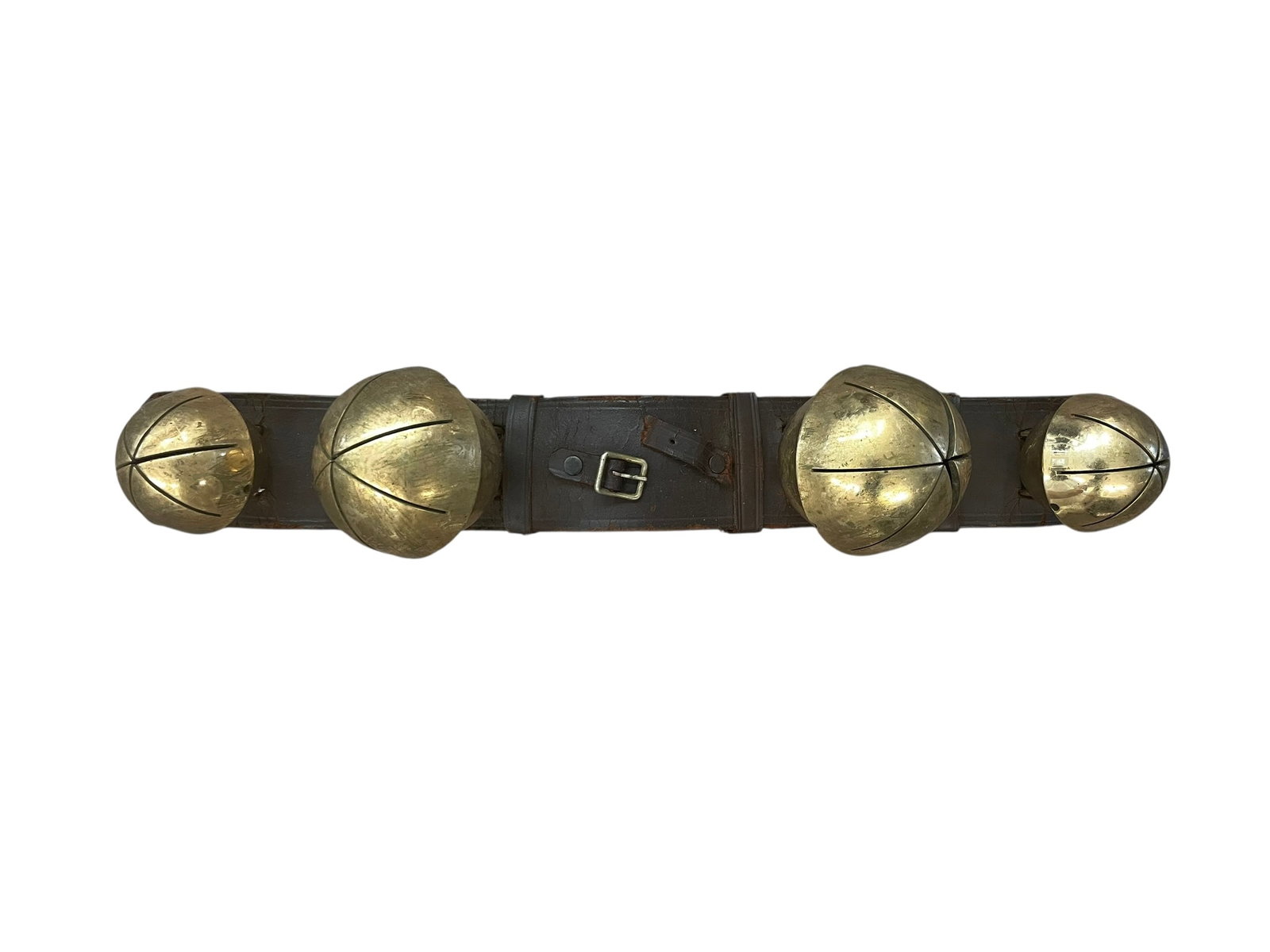 Antique Brass Rump Sleigh Bells: Heavy brass bells on a thick leather strap for a horse and buggy. From a Pennsylvania estate. 17 1/2" long. Largest bells are about 3" diameter.