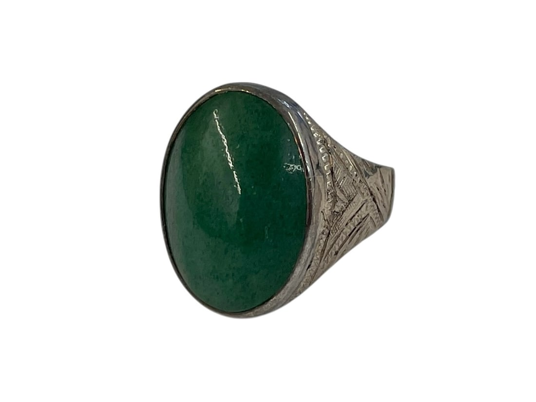 Jadite 835 Silver Ring: Green cabochon stone believed to be jadeite, in a silver setting with etched detail. Stamped 835. Size 9 1/2.