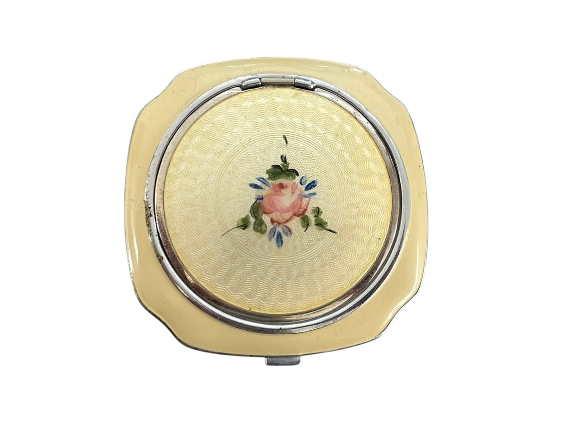 Guilloche Powder Compact by Evans: Light yellow with hand-painted rose decoration. Mirrored lid, and a powder compartment. Evans brand. 2 1/4" square.