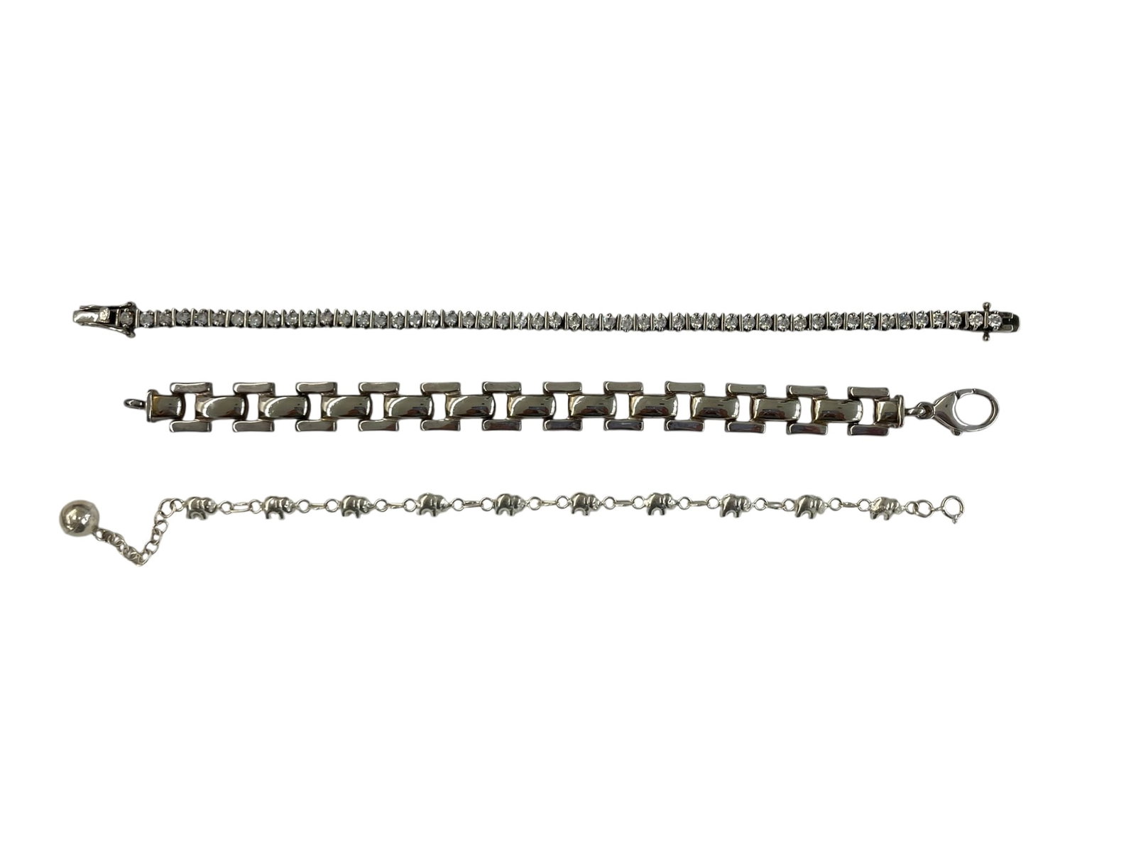 Elephant Bracelet, CZ Tennis Bracelet, Link Bracelet, All Sterling ~ 37.2 grams: 3 silver bracelets in the lot: * Tennis bracelet filled with CZ stones, marked 925 / CZ. 8" long. * Milor Italian link bracelet with easy-fasten clasp, marked 925, 7 1/2" long. * Daint