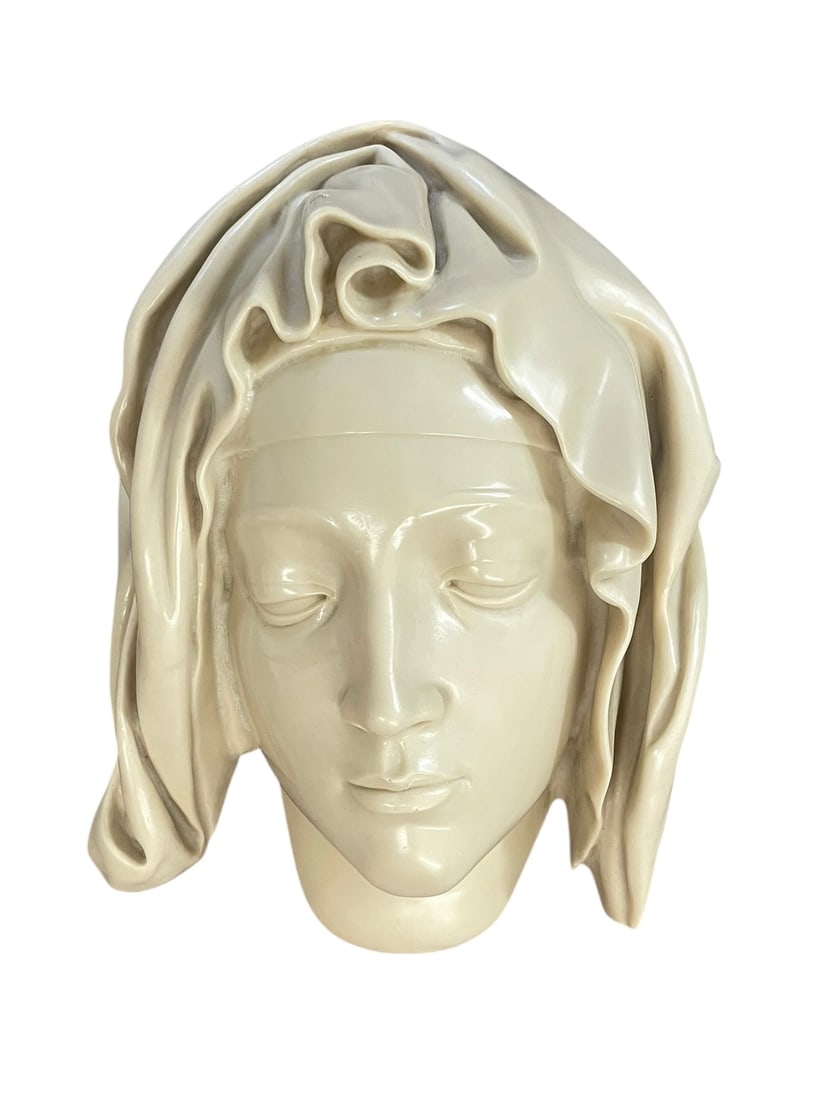 Museum of Modern Art 'Head of the Virgin' Replica: An authorized wall-hanging replica of the Virgin Mary's face from Michelangelo's Pietà. Produced by the Metropolitan Museum of Art (MMA) as part of their Vatican collection, it was cast from