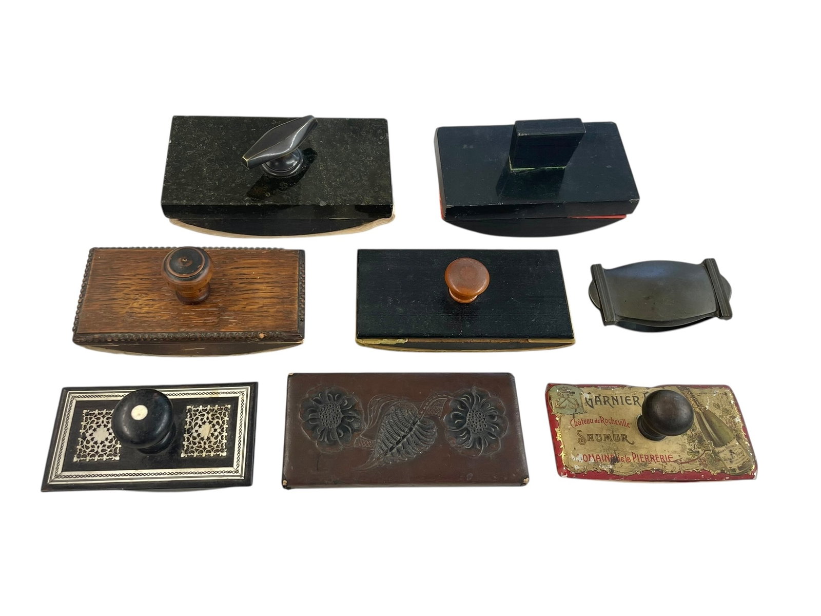 Group of 8 Ink Blotters Including Advertising: Various styles of blotters, some stone/marble, one embossed leather, some wood or metal, one with lacy carved bone appliques, and one advertising Garnier Freres French wine. Sizes range from 4" l