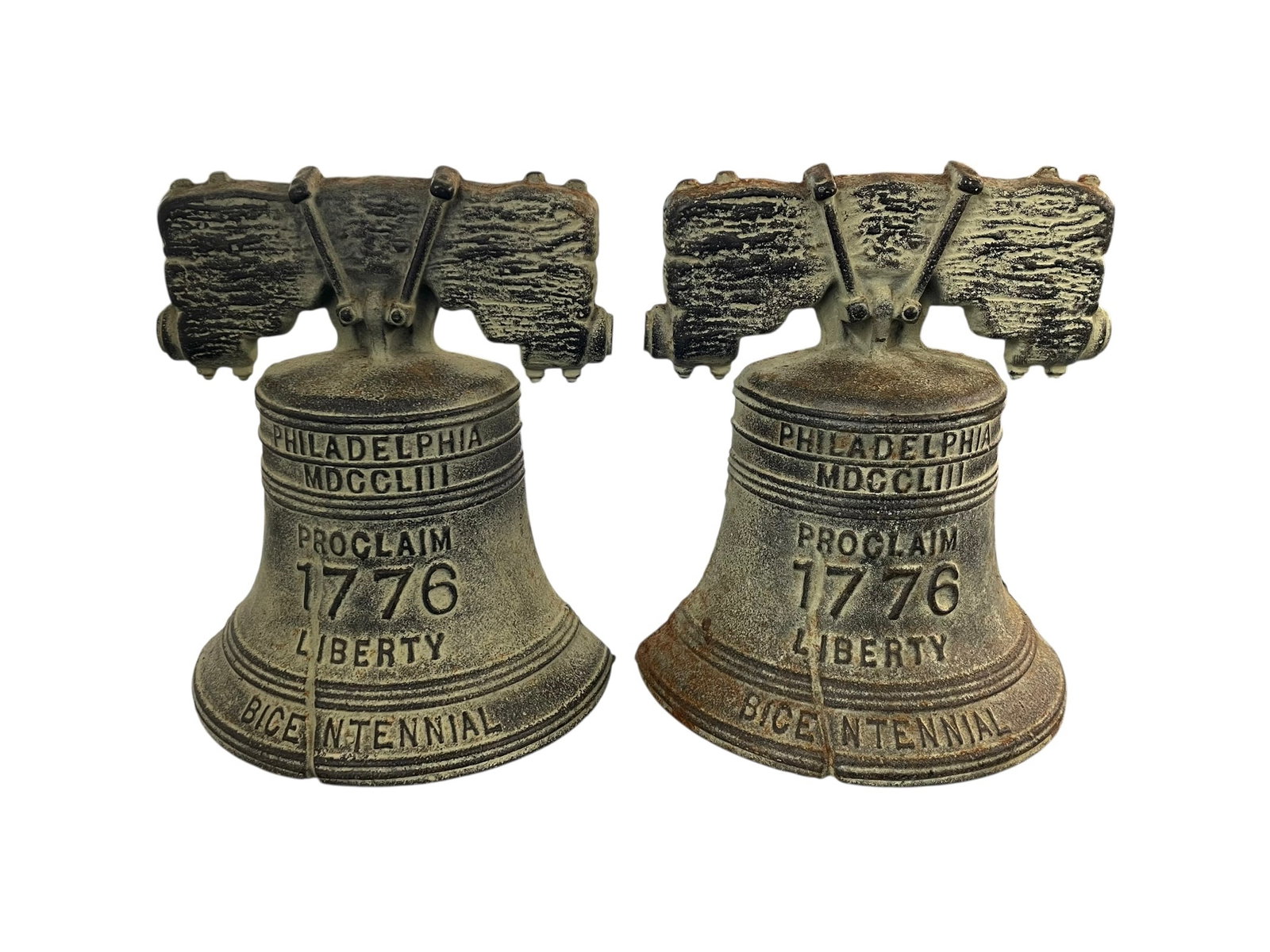 Pair of Liberty Bell Bookends by VMC: Marked VMC for Virginia Metalcrafters, and 76-5, two Bicentennial Liberty Bells, 6" tall. They appear to be patinated cast iron.