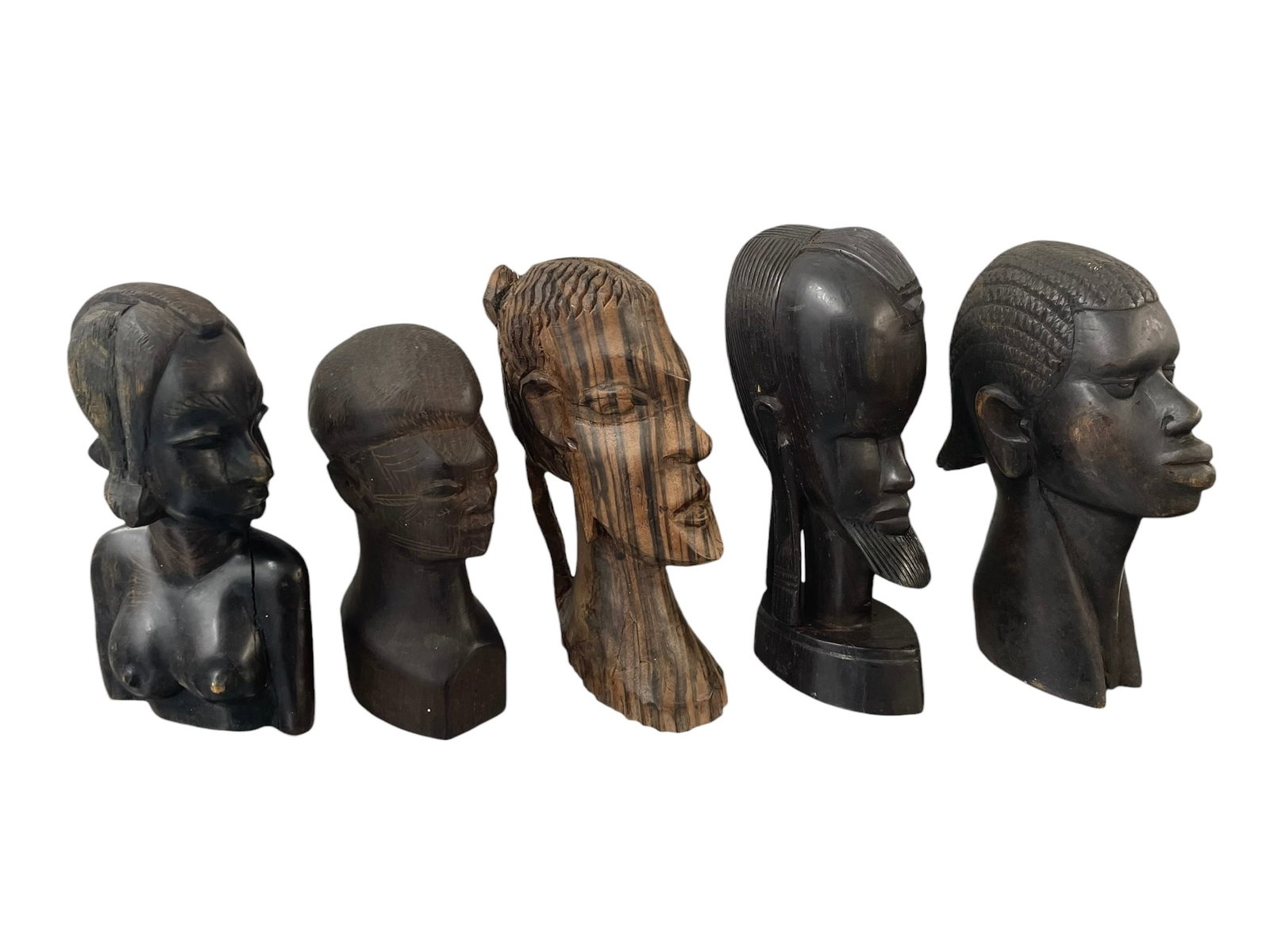 5 Carved Wood African Busts: Collection of four male and one female busts, most are ebony wood, ranging 7 1/4" to 8 3/4" tall.