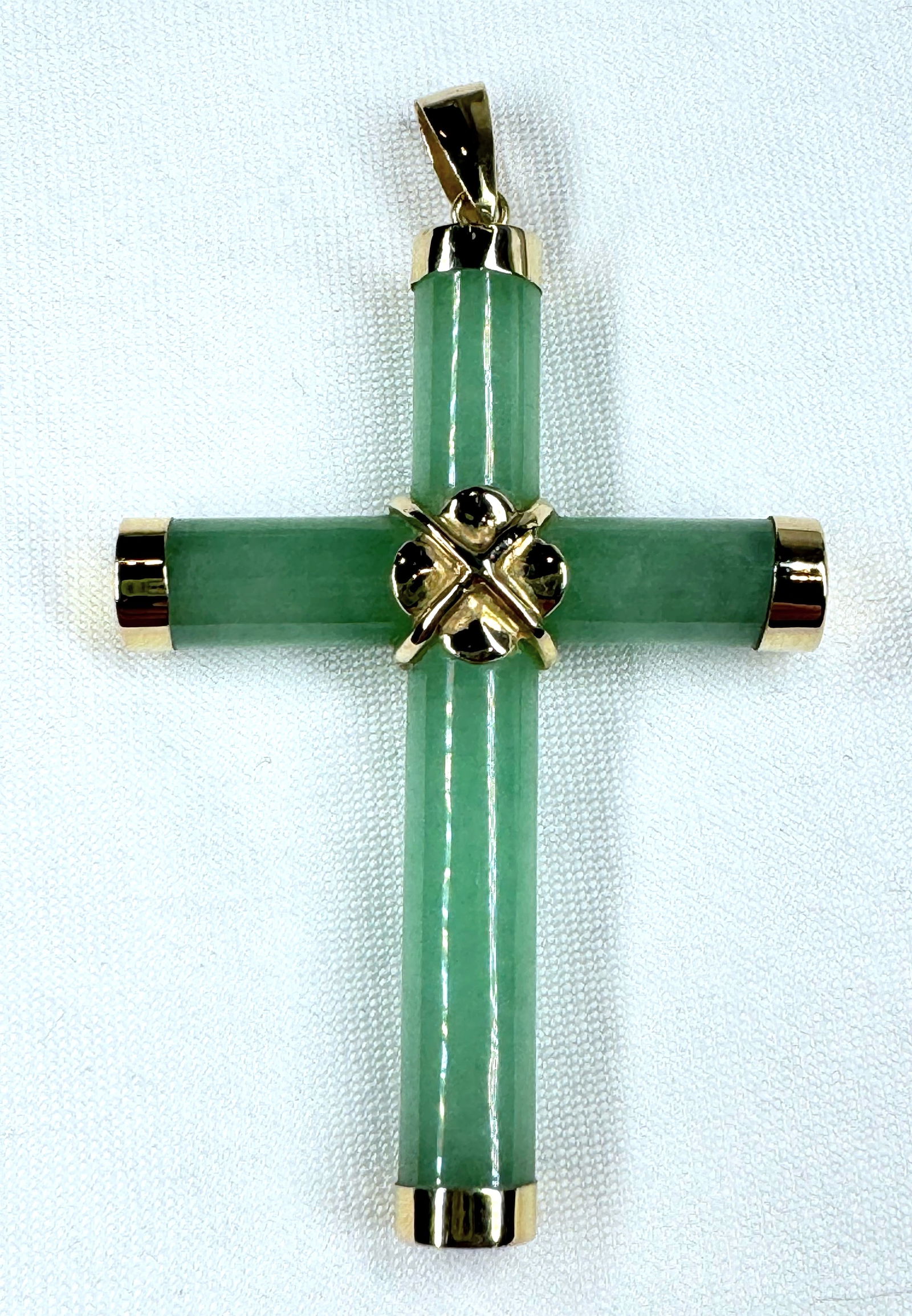 A beautiful green Jade cross pendant in 14k yellow gold. (1 of 2)