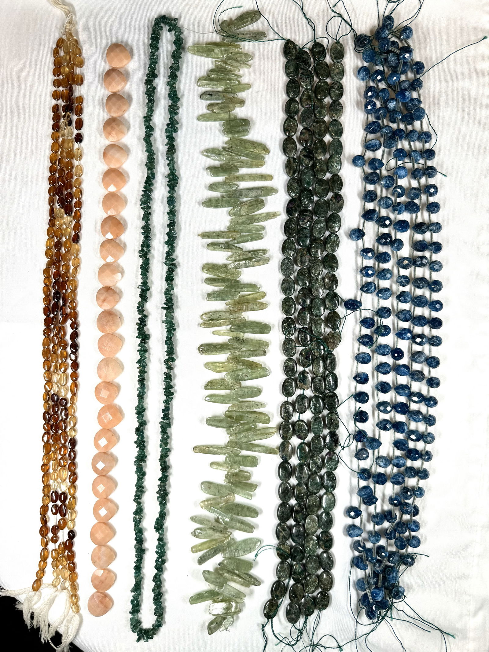 A mixed lot of 17 strands of gemstone beads for jewelry making. (1 of 8)