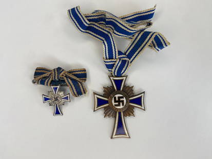 WWII German Mothers Cross in Bronze with Miniature in Silver: WWII Mothers Cross in bronze and Miniature in Silver. Both with original ribbon and dated 10 th December 1938.