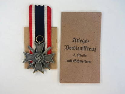 WWII German War Merit Cross with Swords and Original Wrapper + Pouch: Medal and packaging in good condition.