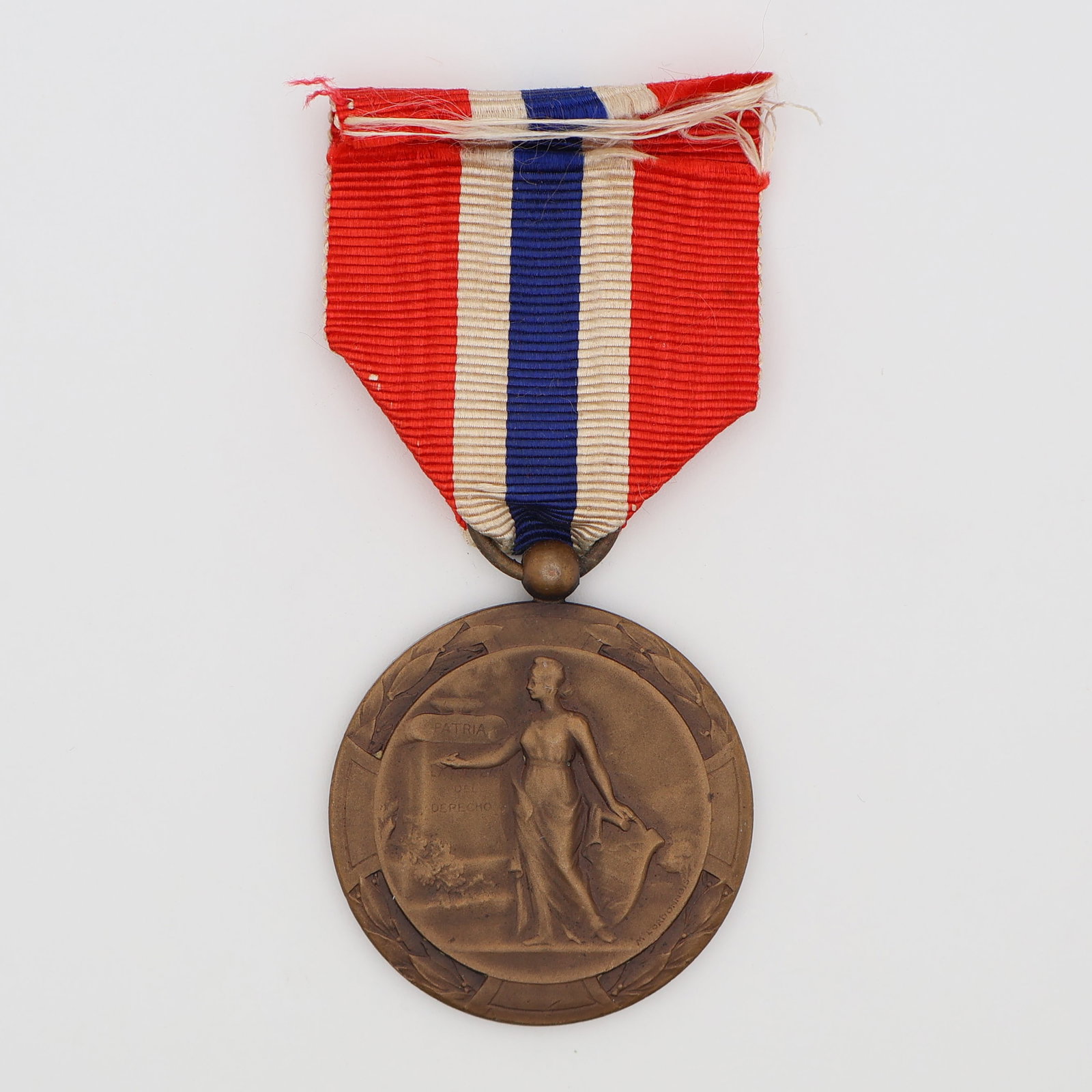 Scarce Panamanian WWI Victory Medal in Bronze: Panama. WWI Victory Medal, full-size bronze grade. Issued after Panama declared war on Germany in 1917, this is among the scarcest of the Allied Victory Medals, distinguished by a unique ribbon of red