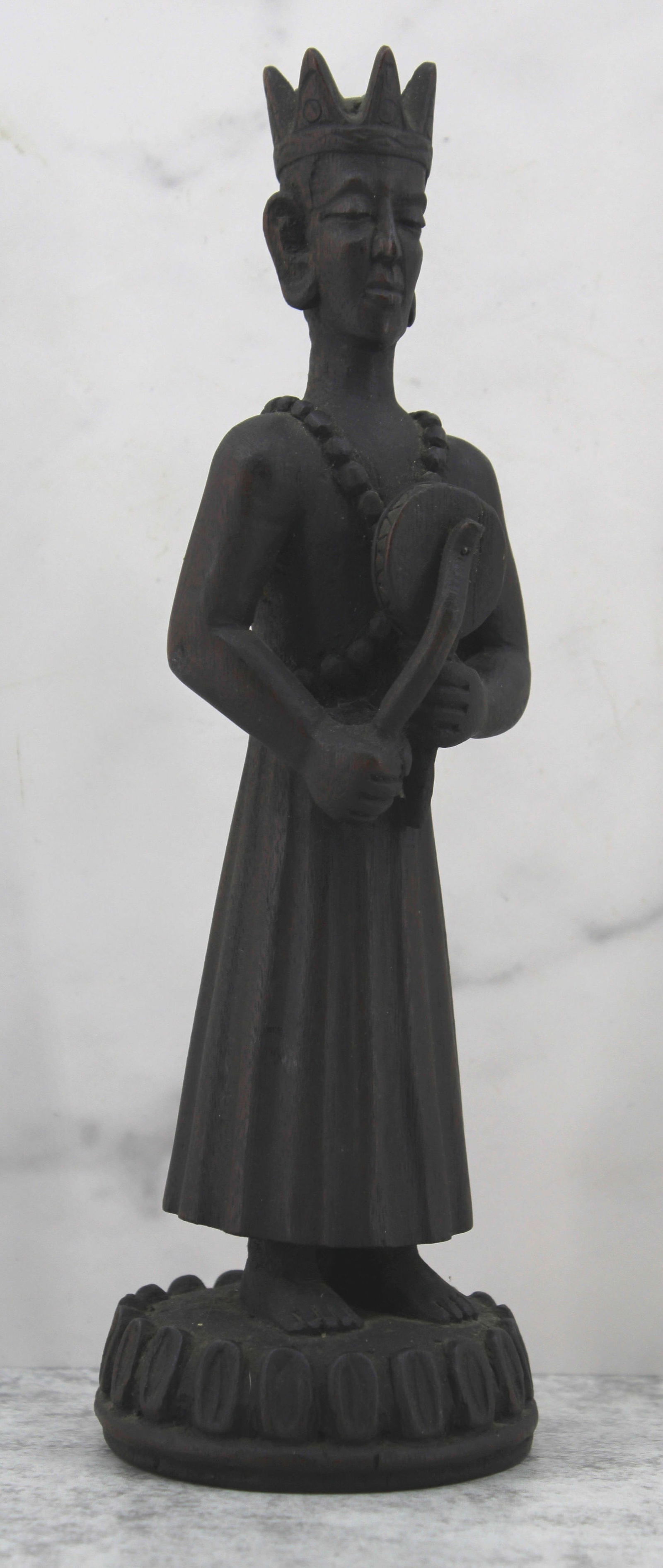 Nepalese Carved Wooden Figure: Carved Nepalese figure with crown and drum. Size: 9"T x 3" diameter base