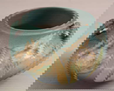 Roseville Pottery jardiniere, two handled urn form  planter, lily floral design, signed on bottom.: Roseville Pottery jardiniere, two handled urn form planter, lily floral design, signed on bottom. Size: 3.5"T x 5.5" diameter