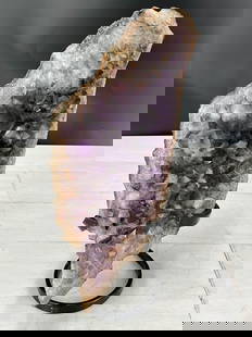 Section of an amethyst geode on custom metal  stand. Size: 12"T x 6"W x 8"D: Section of an amethyst geode on custom metal stand. Size: 12"T x 6"W x 8"D