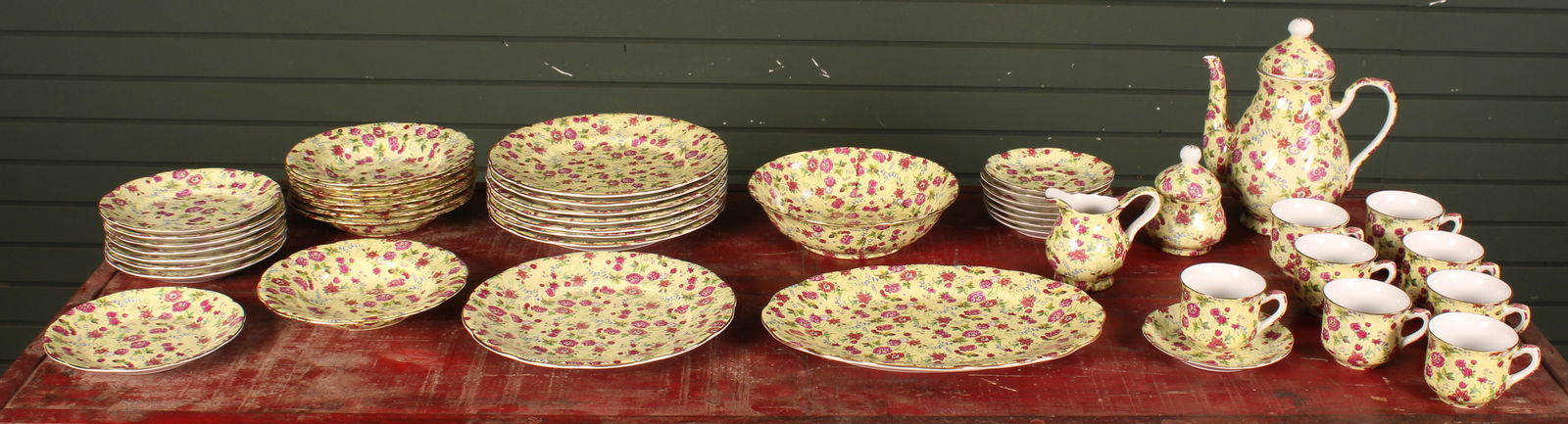 Vintage Charlotte Floral Chintz China Service: Generous collection of china, Charlotte all over floral design, yellow and pink. Service and place settings. Tea pot 10"T, tea cups 3"T. 8 count 10.75" dinner plate. 8 count 8.5" bowl. 8 count 7.5" sa