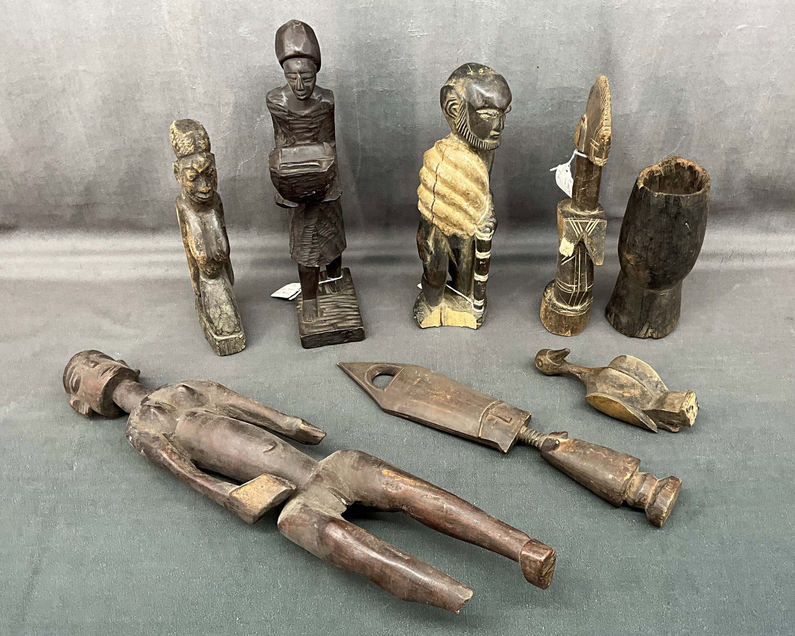 Group of 8 African Artifacts: Including Lobi, Mossi, Kuba and other examples. Condition as is. Size: 7" - 21" T