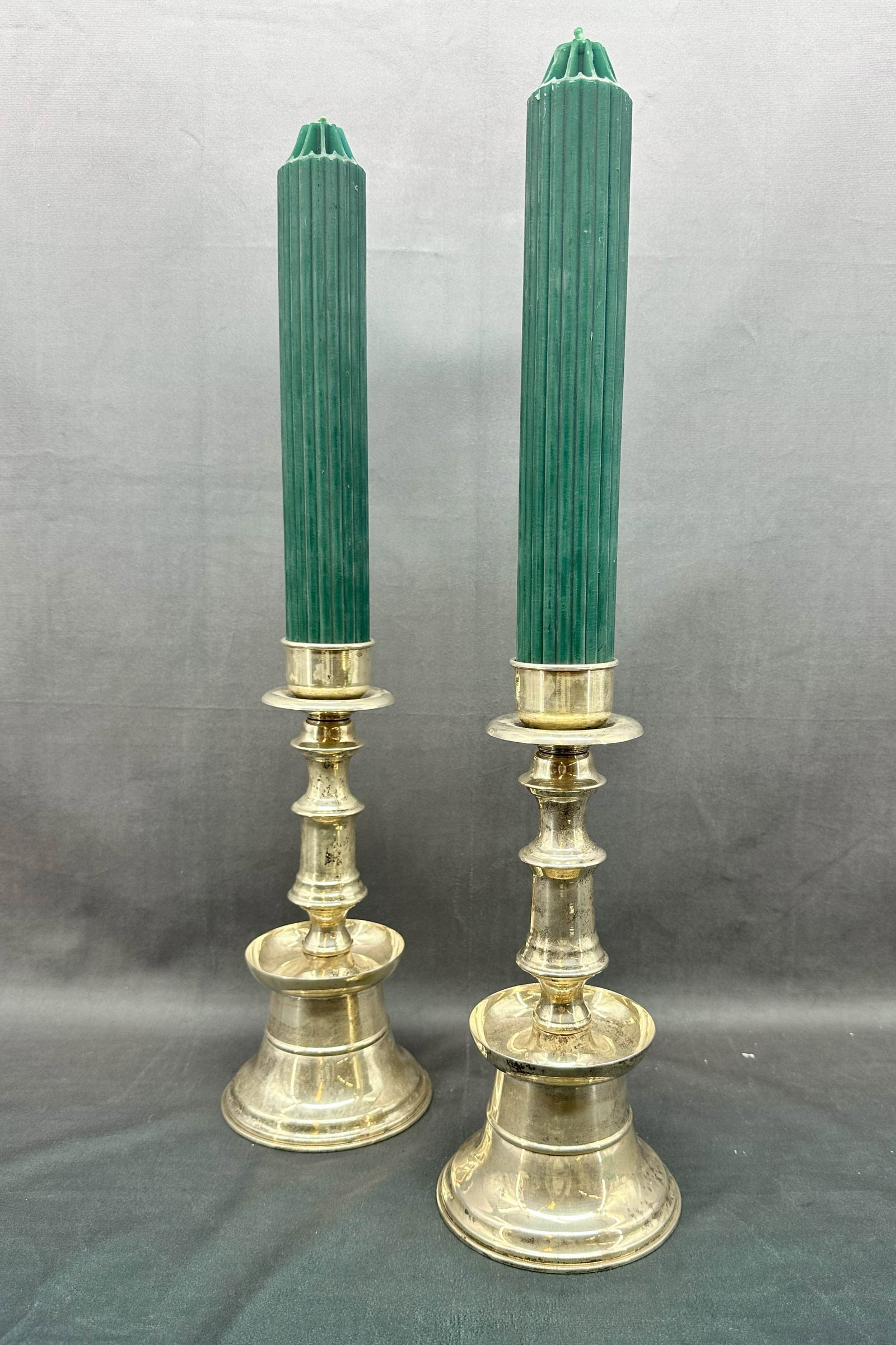 Silver Plate Candlesticks: Traditional style candle stick pair. Holds a larger sized taper. Candles Included. No marks. Size: 11.25"T x 5" diameter base, without candles