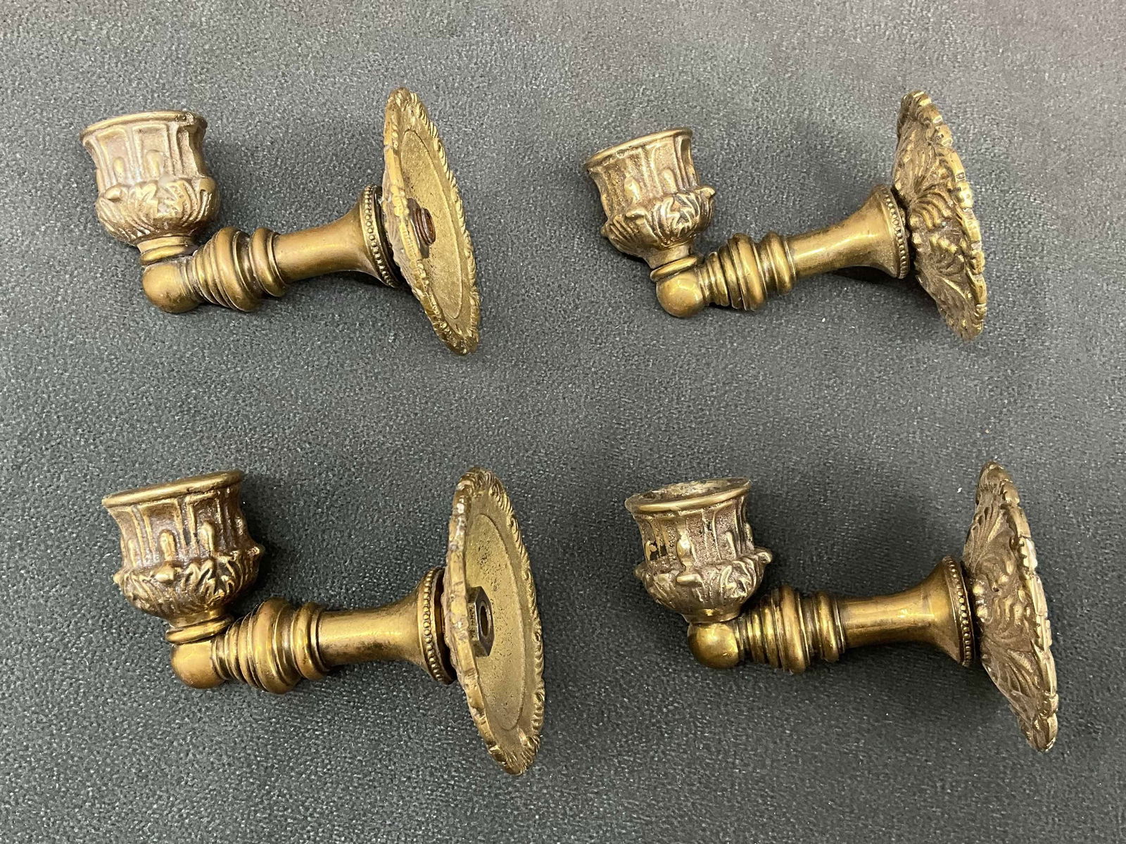 4 Brass Wall Mount Candlesticks: 4 Brass Wall Mount Candlesticks. Size: 2.75" diameter mount, 3.25" D