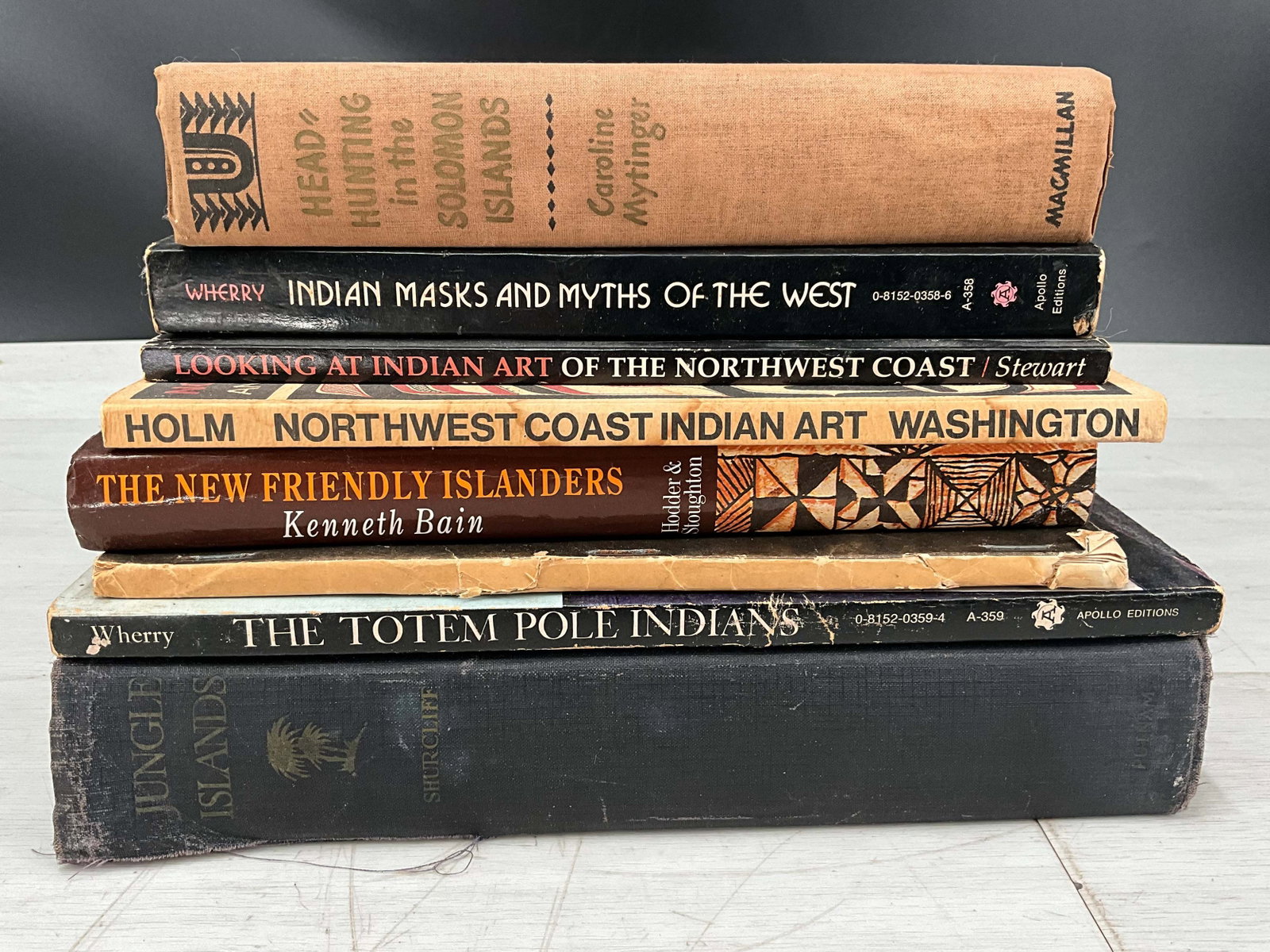 Pacific Northwest & Island Themed Books: Library collection of Pacific Northwest and Pacific Island art and anthropolgy. Head Hunting in the Soloman Islands, Indian Masks and Myths of the West, Looking at Indian Art of the Northwest Coast, N