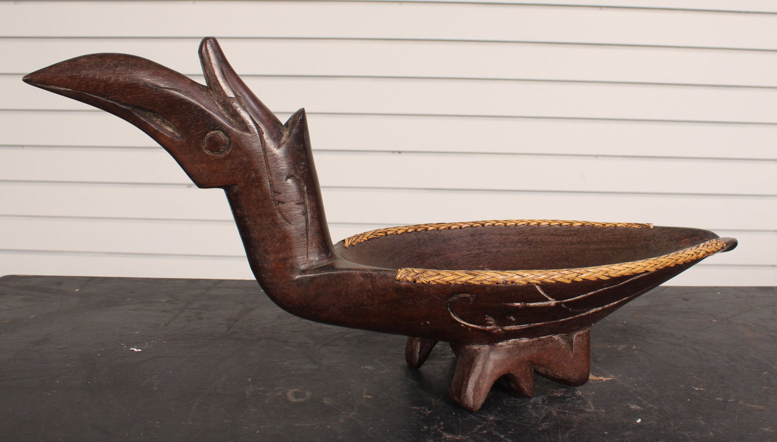 Borneo Dayak Effigy Bowl: Borneo Dayak Effigy Bowl. Carved wood and braided grass. Size: 8.5"H x 18.5"W x 6.5"D