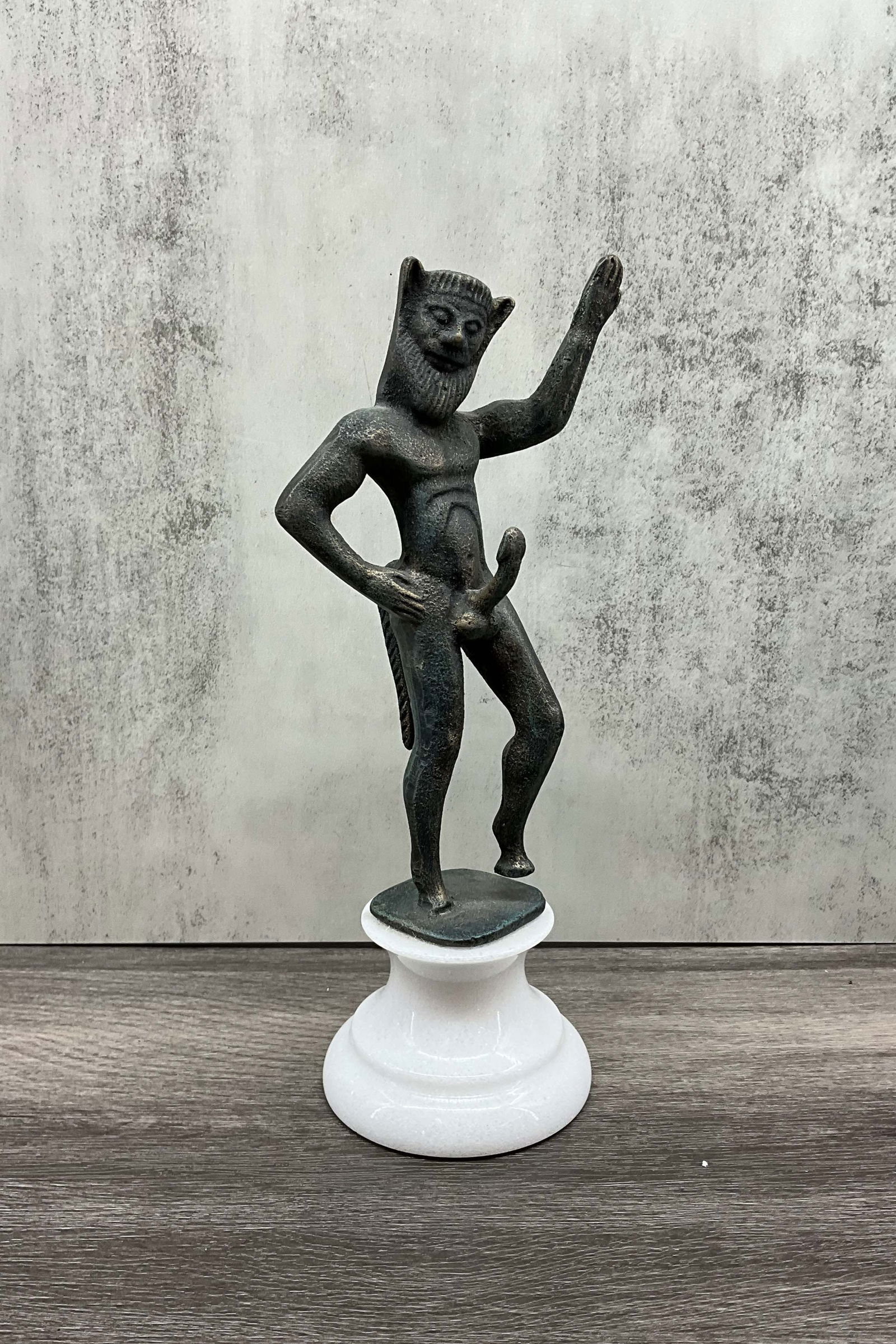 Erotic Satyr On Granite Plinth: Neoclassical satyr cabinet statue, cast iron with a carved granite base. Size: 10"T x 3.5" diameter at base